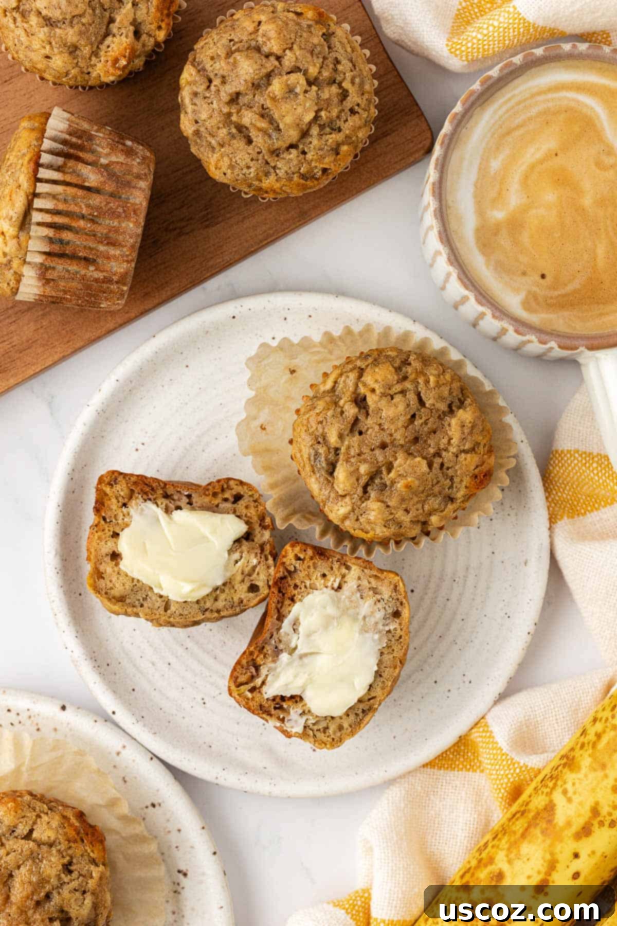 Deliciously Healthy Banana Muffins 14 banana muffin cut in half and topped with butter