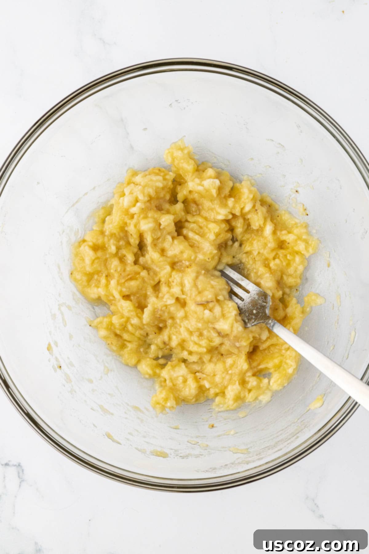 Deliciously Healthy Banana Muffins 6 ripe mashed bananas in a mixing bowl