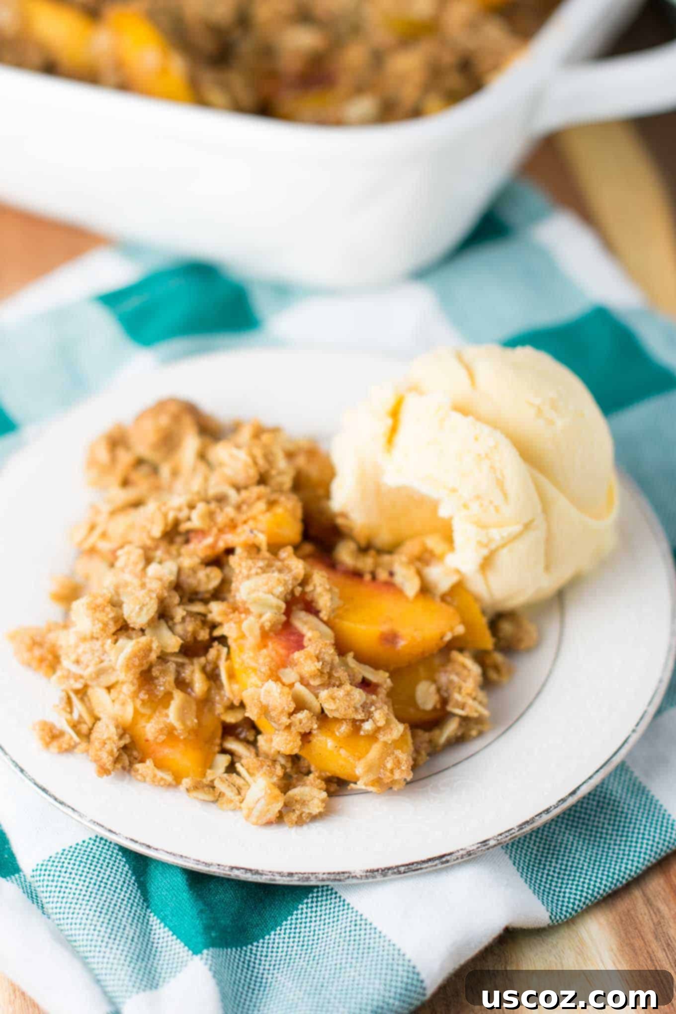 Delicious & Easy Peach Crisp 2 Easy peach crisp recipe with frozen peaches, served in a casserole dish