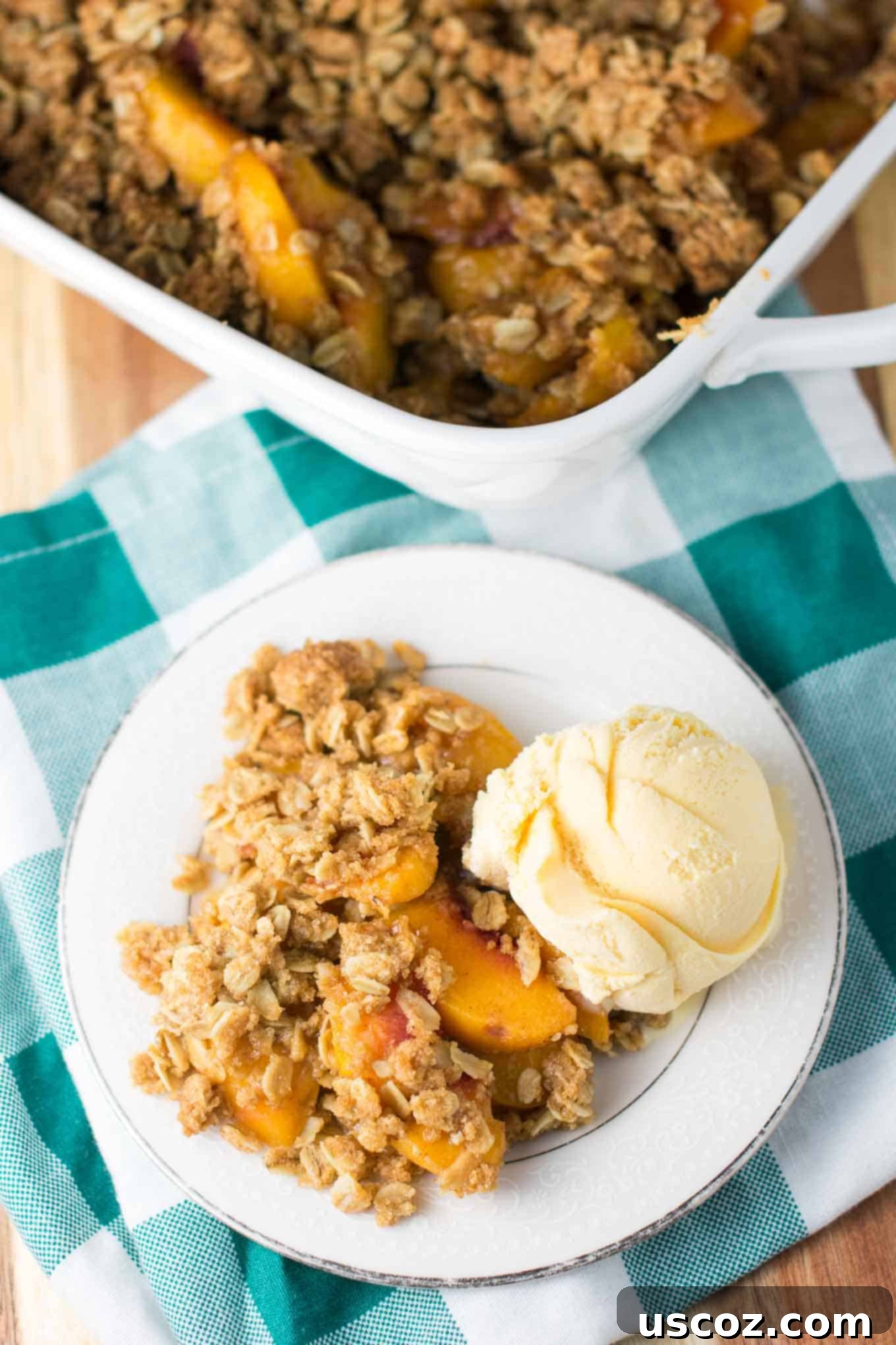 Delicious & Easy Peach Crisp 3 Partially thawed frozen peaches in a mixing bowl ready for crisp filling