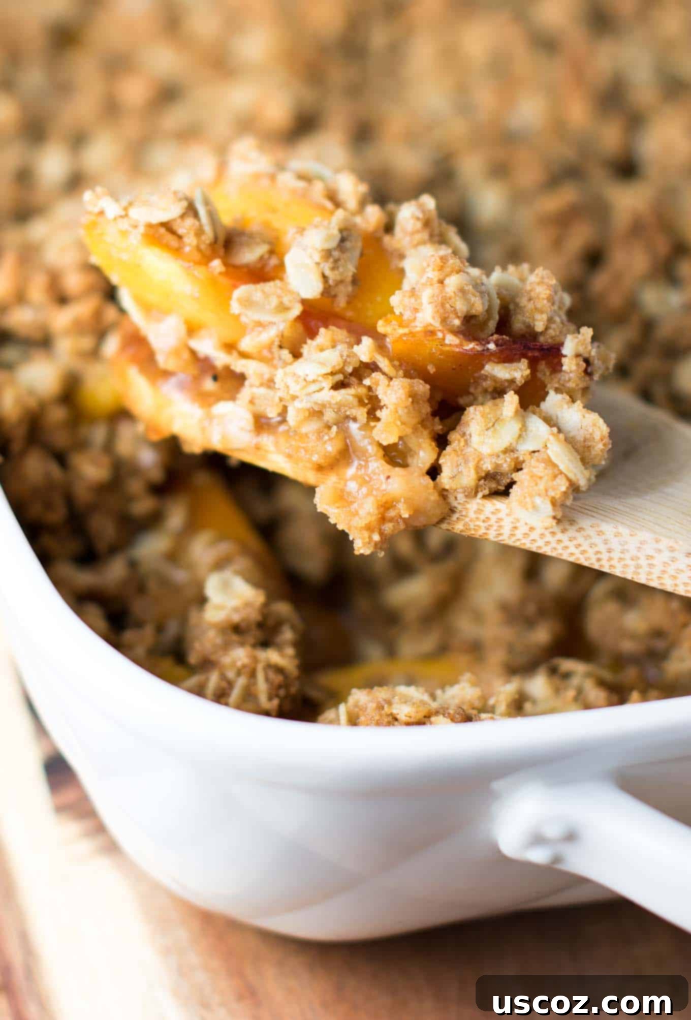Delicious & Easy Peach Crisp 4 Tossing sliced peaches with brown sugar, cornstarch, cinnamon, and nutmeg