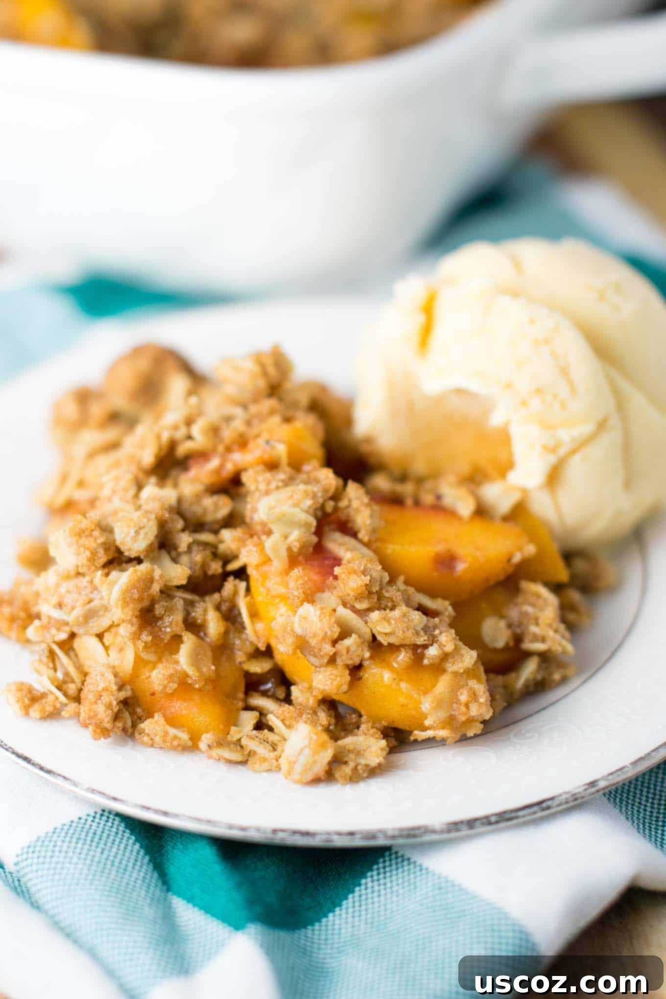 Delicious & Easy Peach Crisp 6 Warm easy peach crisp with a scoop of melting vanilla ice cream