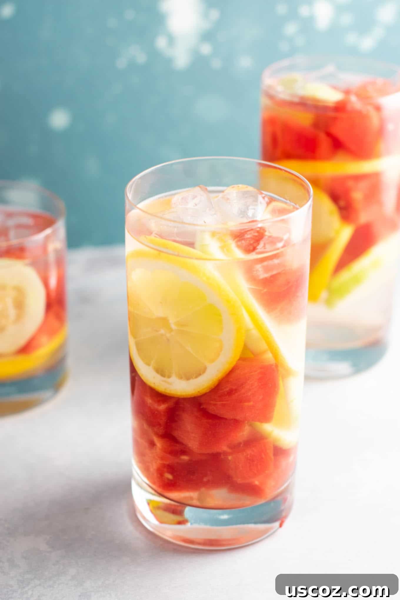 Hydrating Watermelon Detox Elixir 7 A refreshing glass of Watermelon Detox Water with ice, cucumber, and lemon slices. Emphasizing its hydrating benefits for summer.