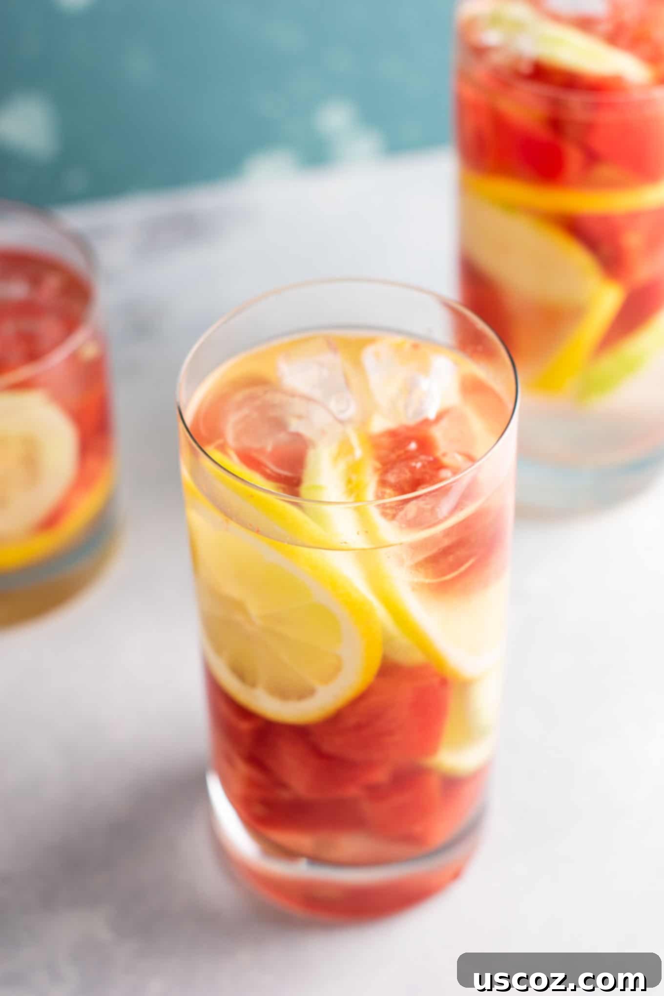 Hydrating Watermelon Detox Elixir 9 Watermelon Detox Water being poured into a glass with fresh fruit, emphasizing its refreshing qualities and ease of preparation.