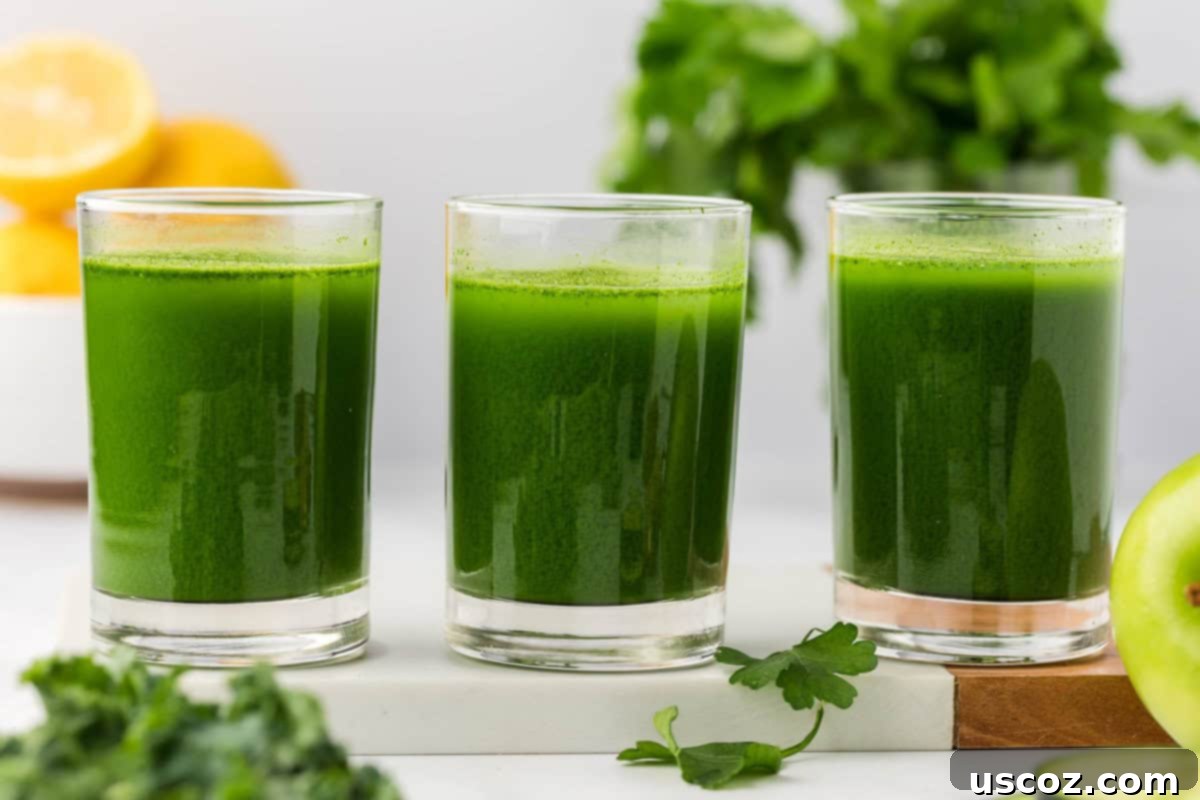 Vital Veggie Boost 10 Several glasses of green vegetable juice arranged artfully on a table.