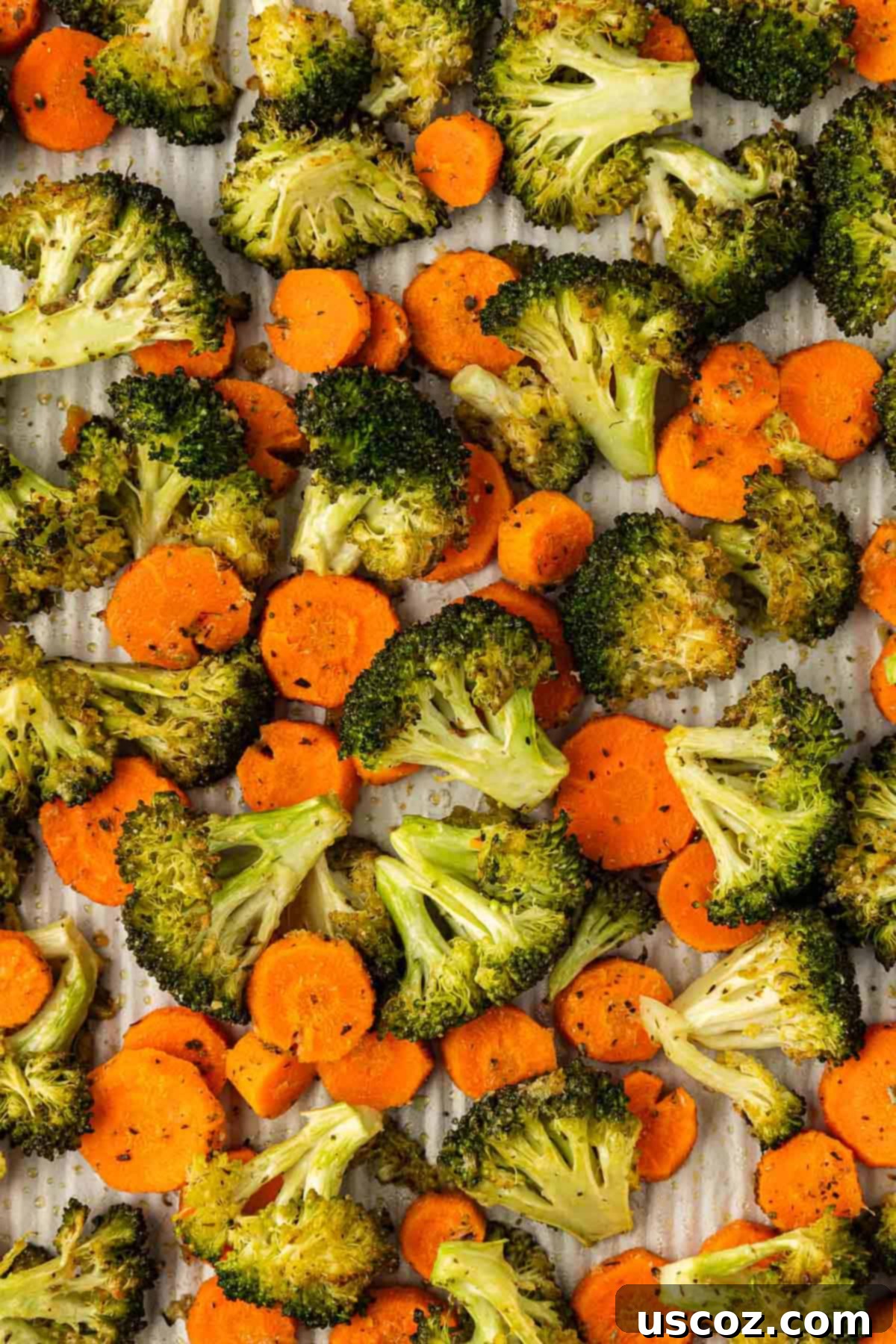 Crispy Roasted Broccoli and Carrots 2 roasted broccoli and carrots on a baking sheet