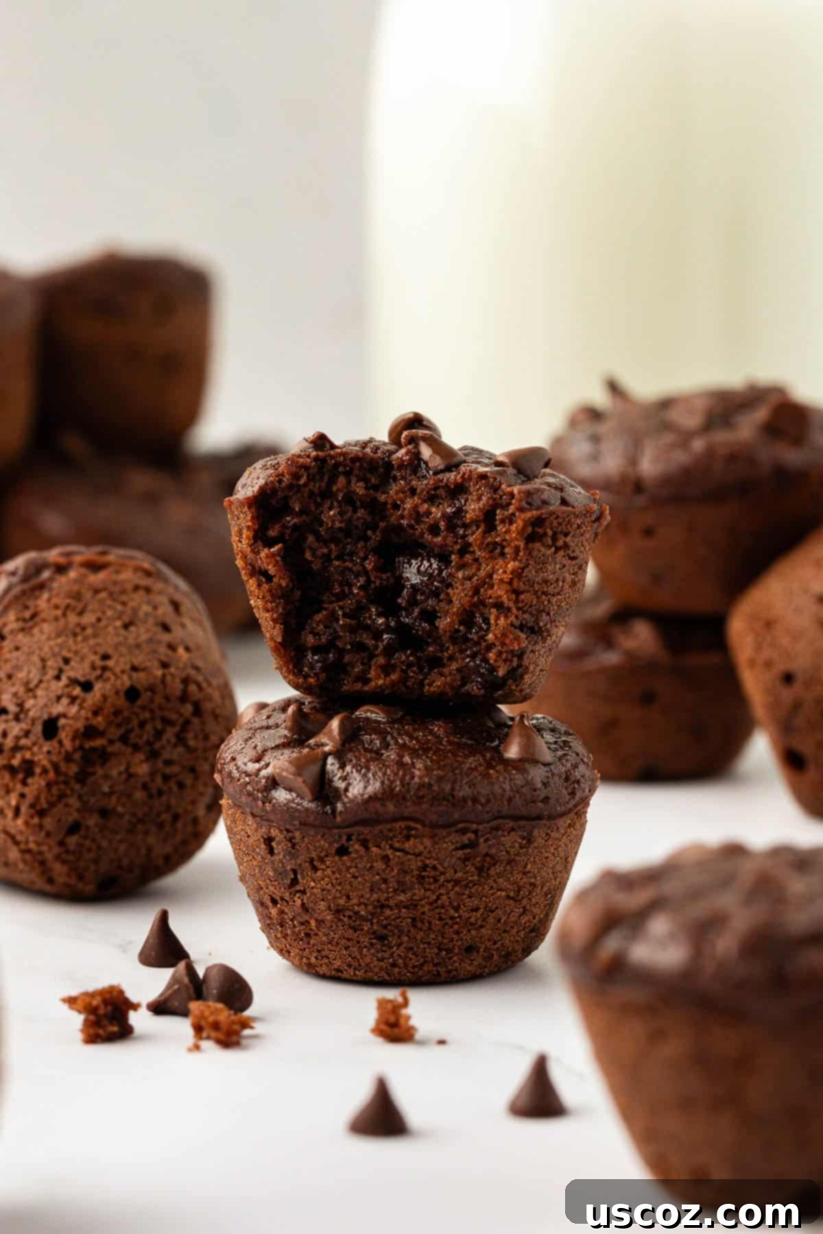 Guilt-Free Chocolate Mini Muffins 16 Stack of healthy chocolate mini muffins, ready for serving or storage.