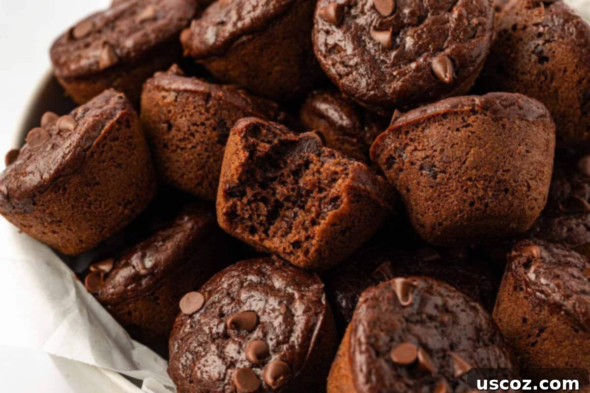 Guilt-Free Chocolate Mini Muffins 3 Close-up of baked healthy chocolate mini muffins, showing their moist texture.