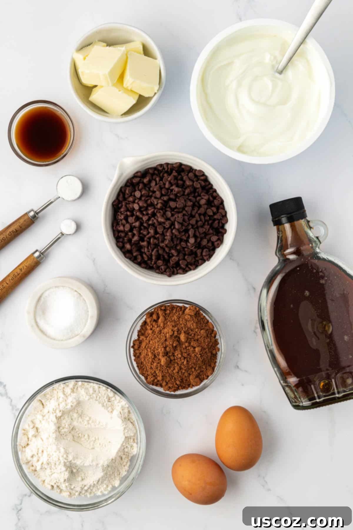 Guilt-Free Chocolate Mini Muffins 4 All the dry and wet ingredients laid out on a table for making healthy chocolate muffins.