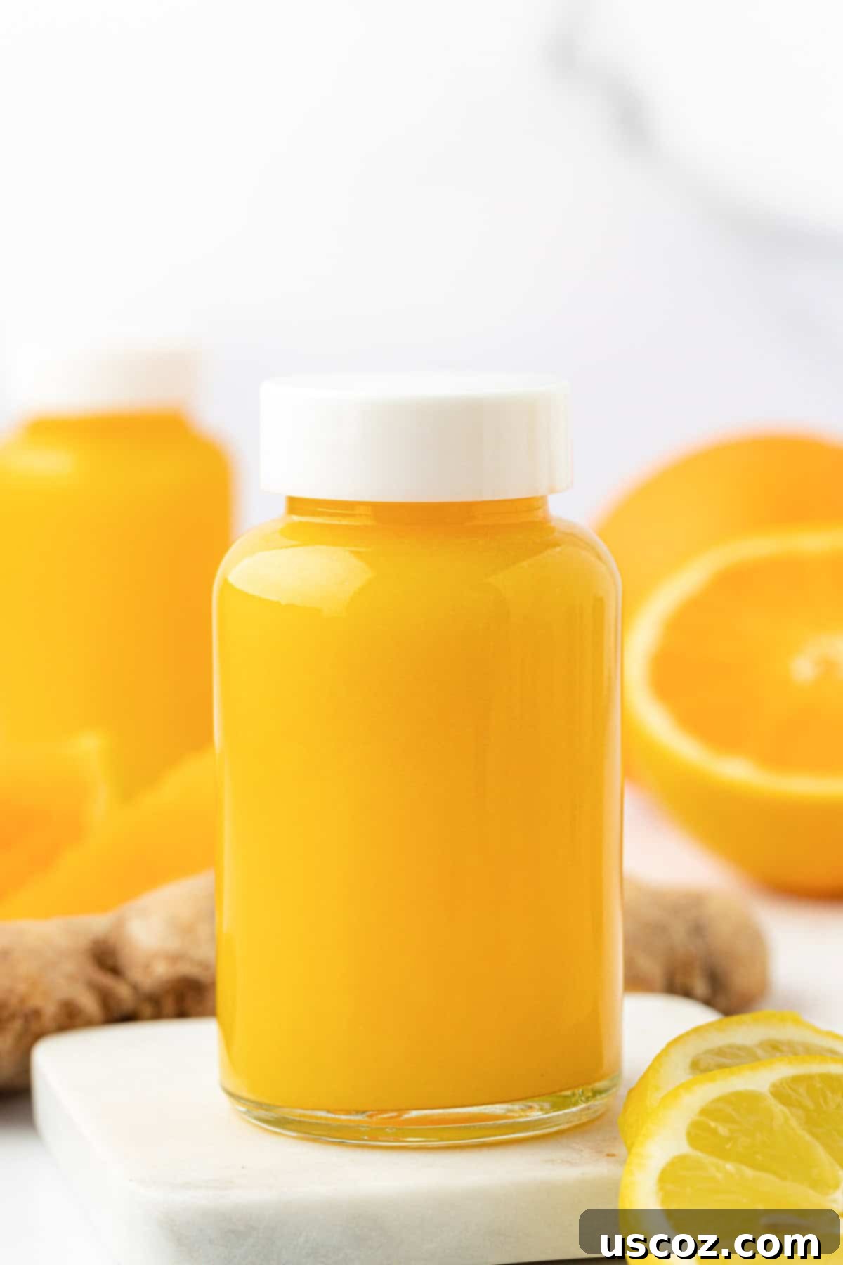 Immune Boost Shots 7 Several individual immunity shots bottled and lined up, showcasing the vibrant orange color.
