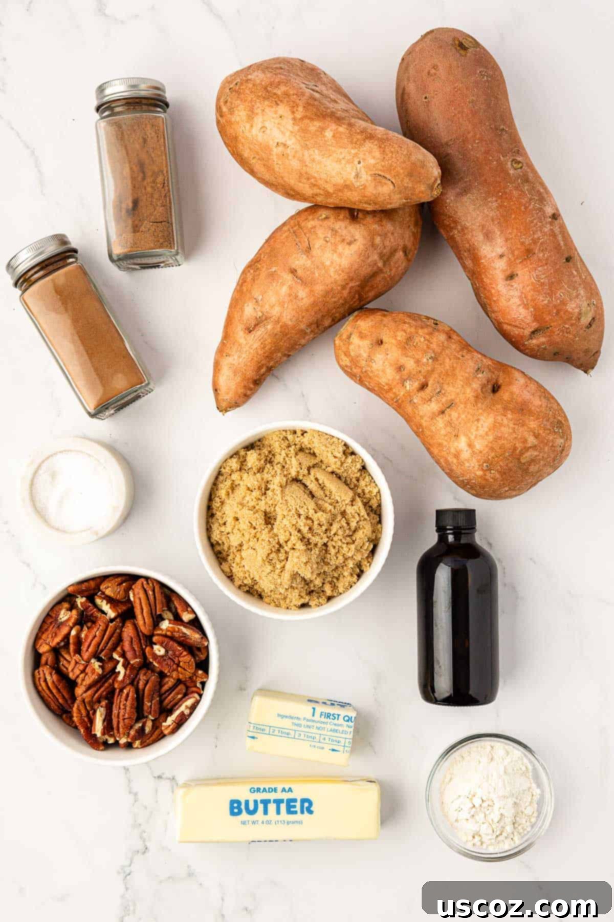 Golden Sweet Potato & Pecan Delight 4 Organized layout of ingredients required for sweet potato casserole: whole sweet potatoes, brown sugar, butter, and an assortment of spices.