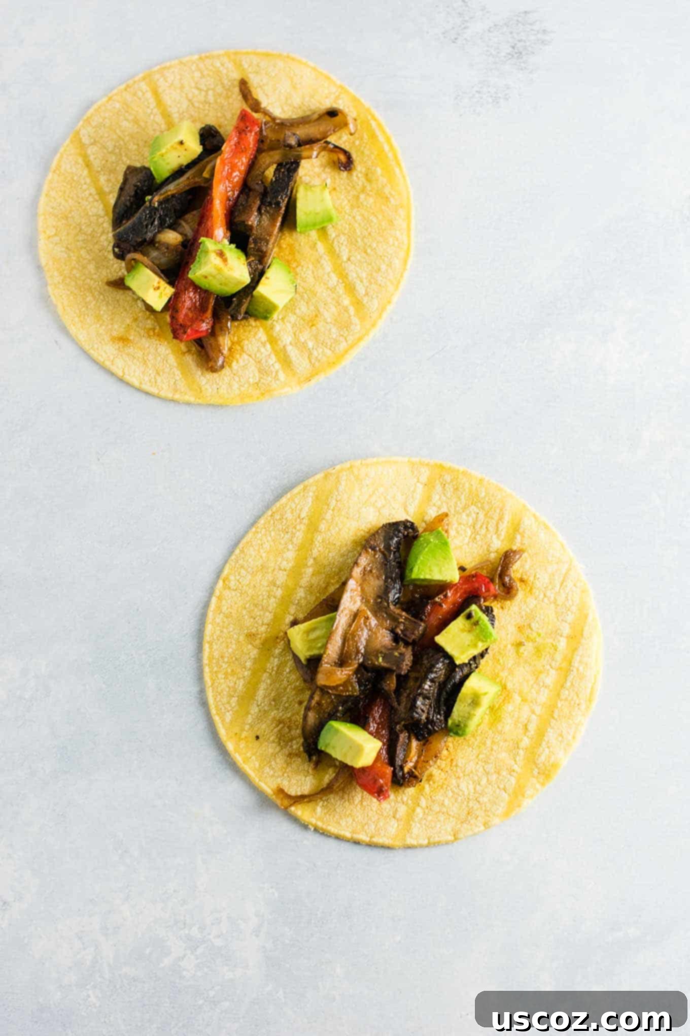 Sizzling Portobello Fajitas 2 mushroom fajitas on a corn tortilla with diced avocado
