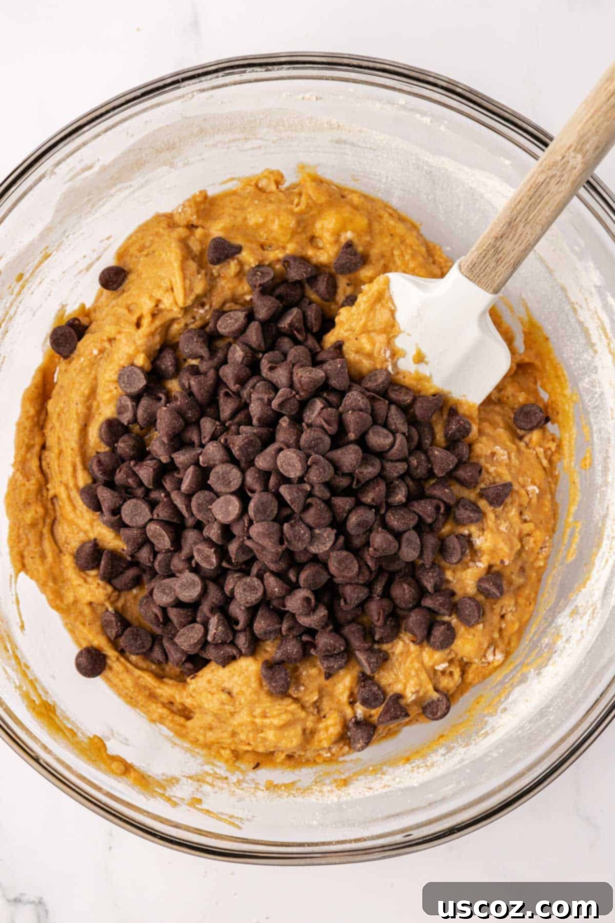 Spiced Pumpkin Chocolate Chip Muffins 11 adding chocolate chips to the batter