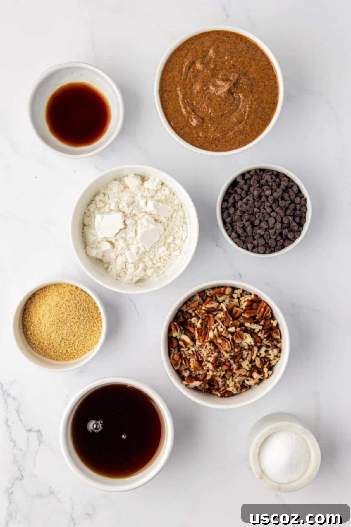 Pecan Pie Power Bites 4 ingredients needed to make pecan pie energy balls, including almond butter, pecans, maple syrup, and protein powder
