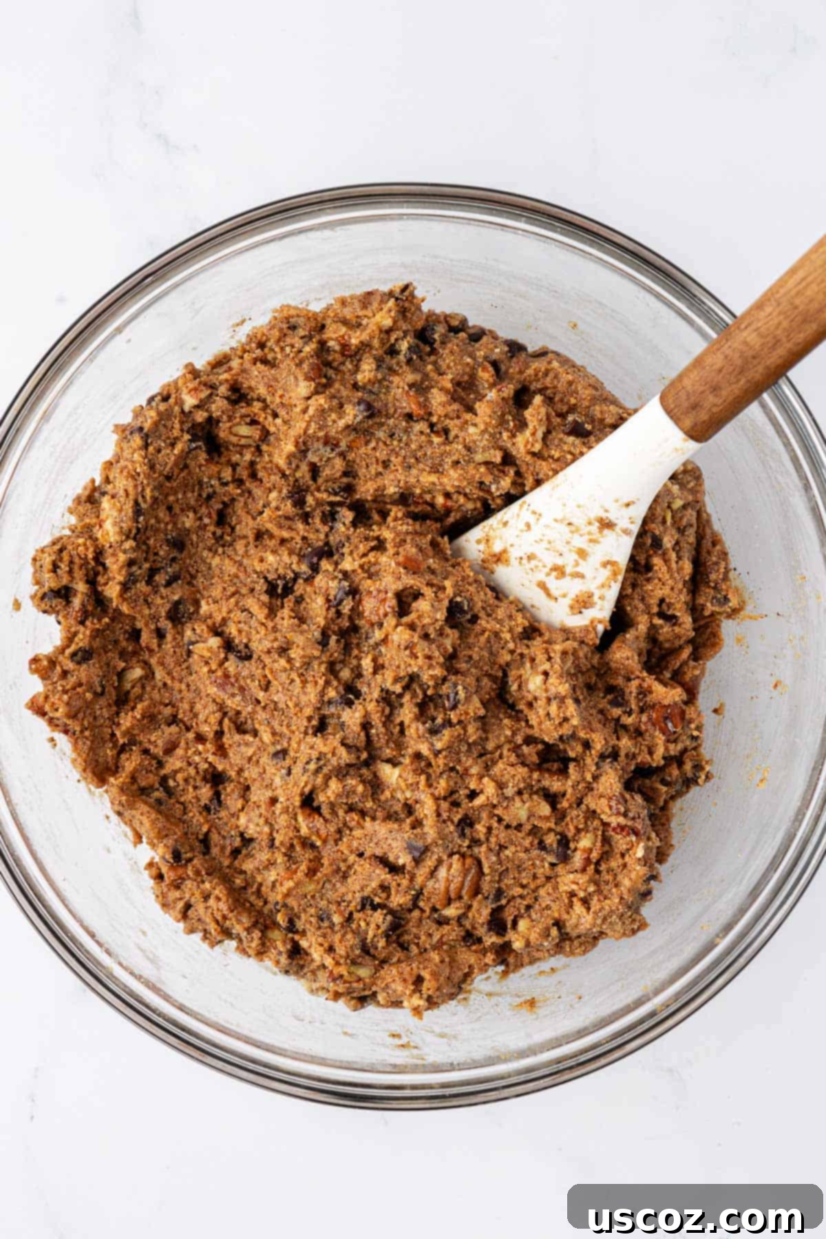 Pecan Pie Power Bites 6 batter mixed together in a mixing bowl for pecan pie energy bites
