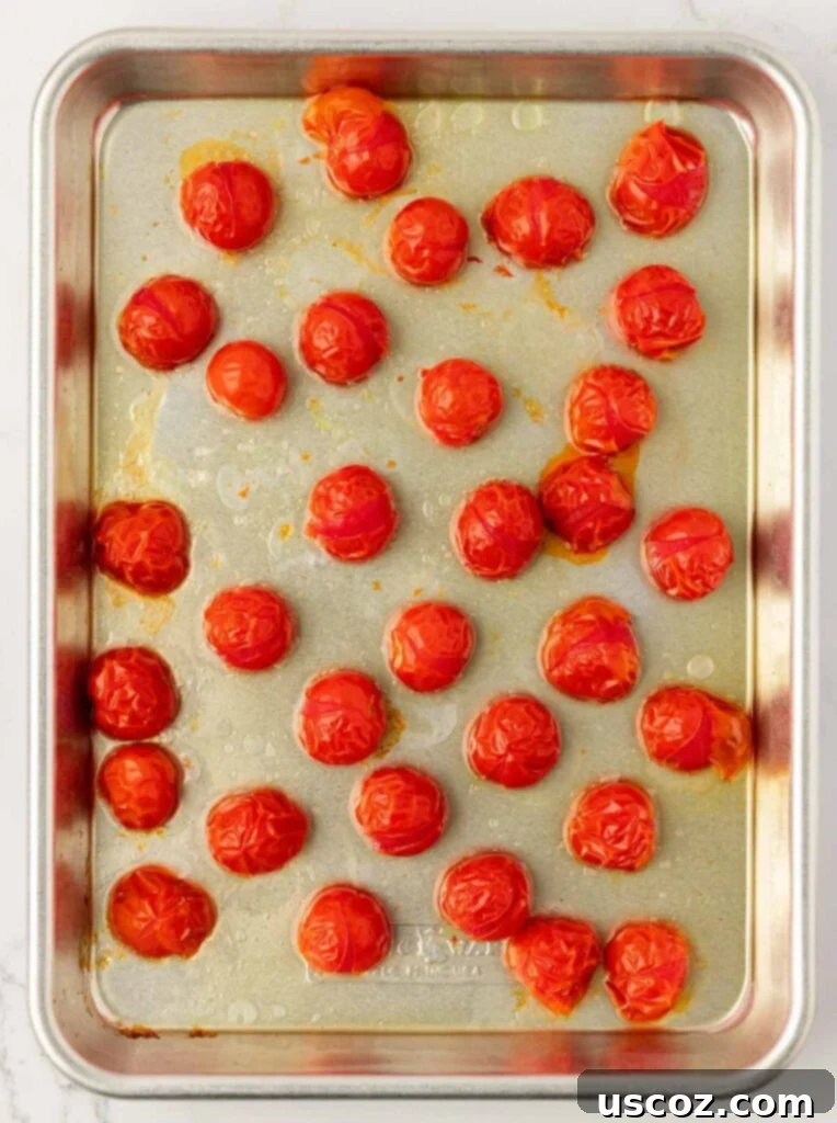 roasted cherry tomatoes on a baking sheet