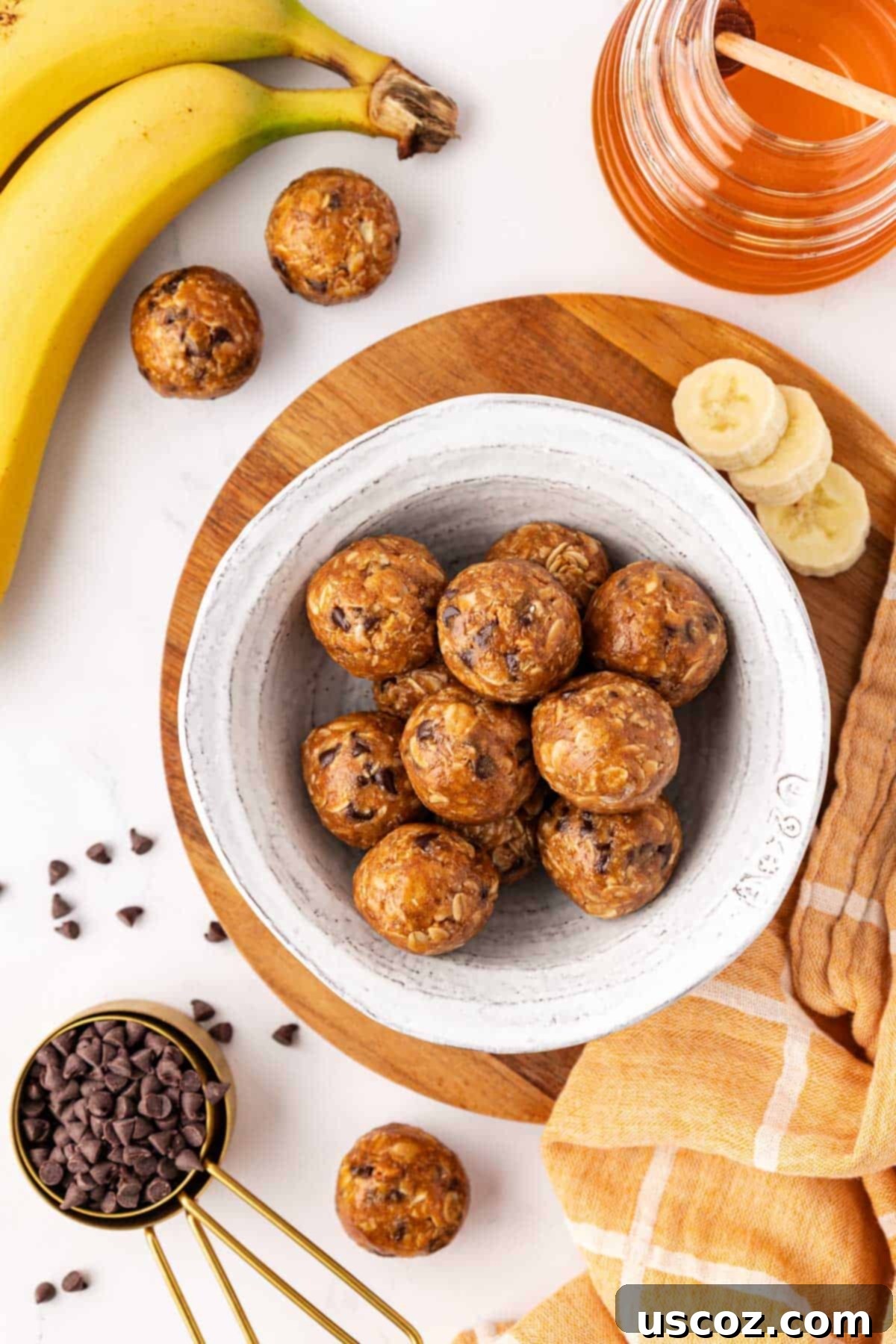 Banana Bread Energy Bites 11 Assortment of banana bread energy bites on a rustic wooden surface