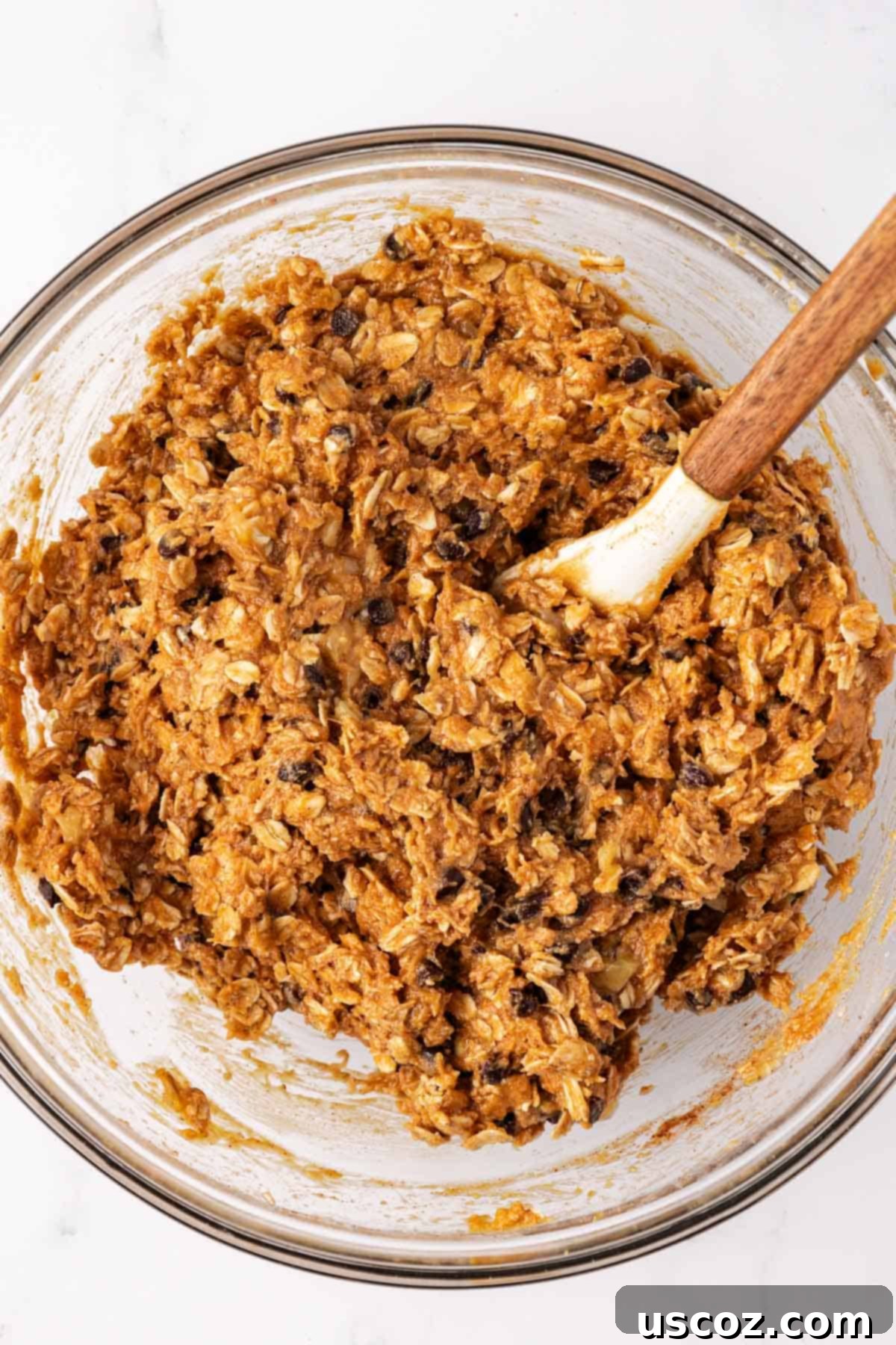 Banana Bread Energy Bites 6 Mixed protein ball batter in a mixing bowl