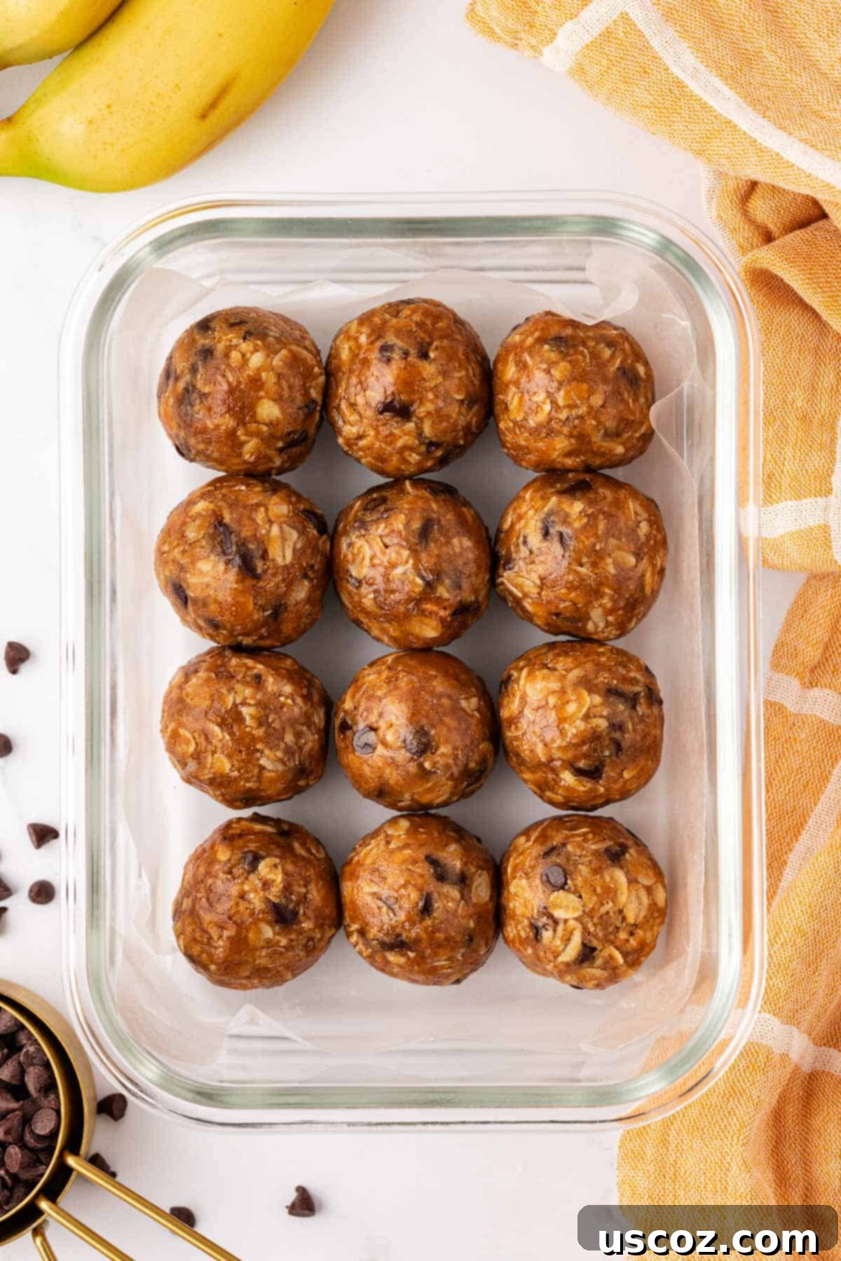 Banana Bread Energy Bites 9 Banana bread energy bites stored in a container