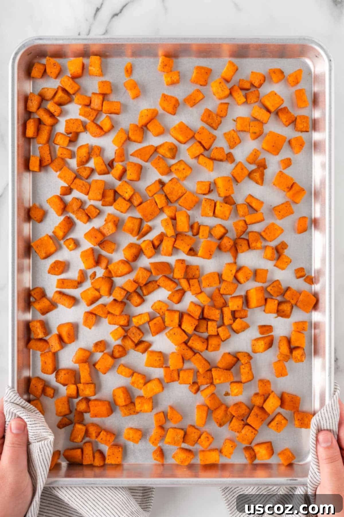 Golden Roasted Sweet Potato Bites 2 Crispy roasted sweet potatoes perfectly golden brown on a baking sheet, ready to serve.