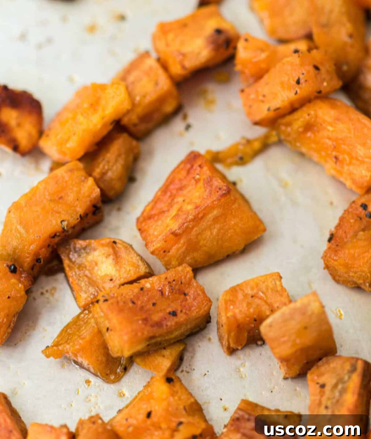 Golden Roasted Sweet Potato Bites 4 A close-up of beautifully roasted sweet potatoes, seasoned and ready to be enjoyed, showcasing their golden-brown edges.