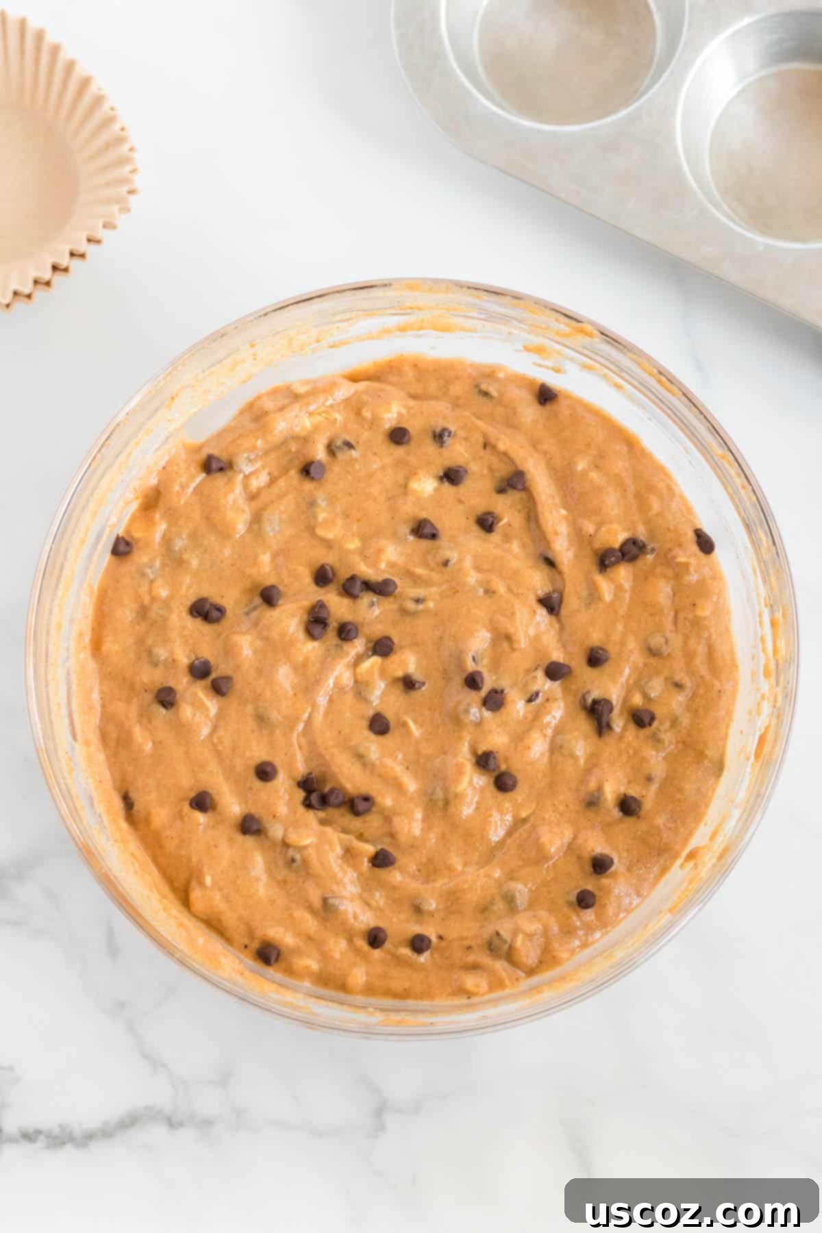 Guilt-Free Pumpkin Chocolate Chip Muffins 8 Healthy pumpkin chocolate chip muffin batter in a bowl, ready for baking