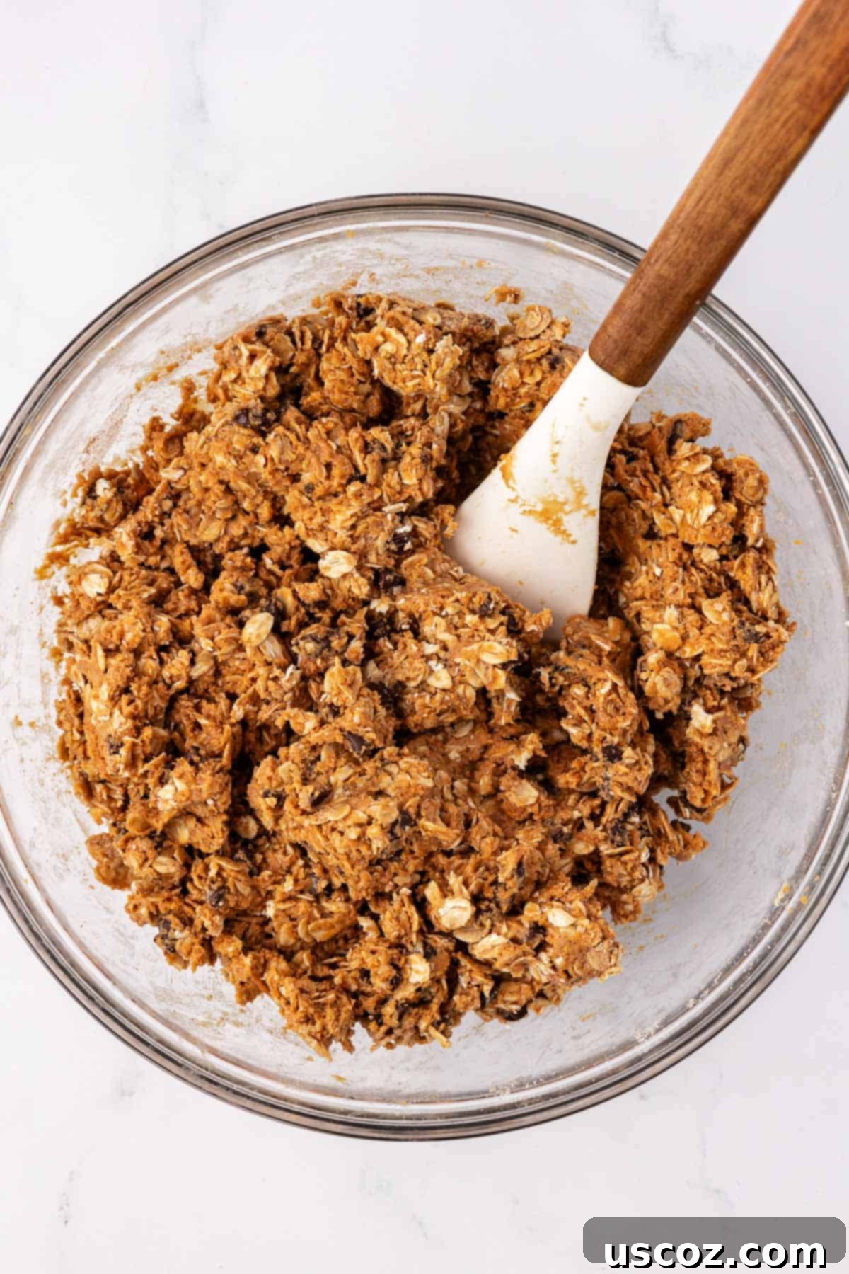 Oat Cookie Power Bites 6 Thick, well-mixed energy ball batter in a bowl, showing the consistency and combined ingredients.