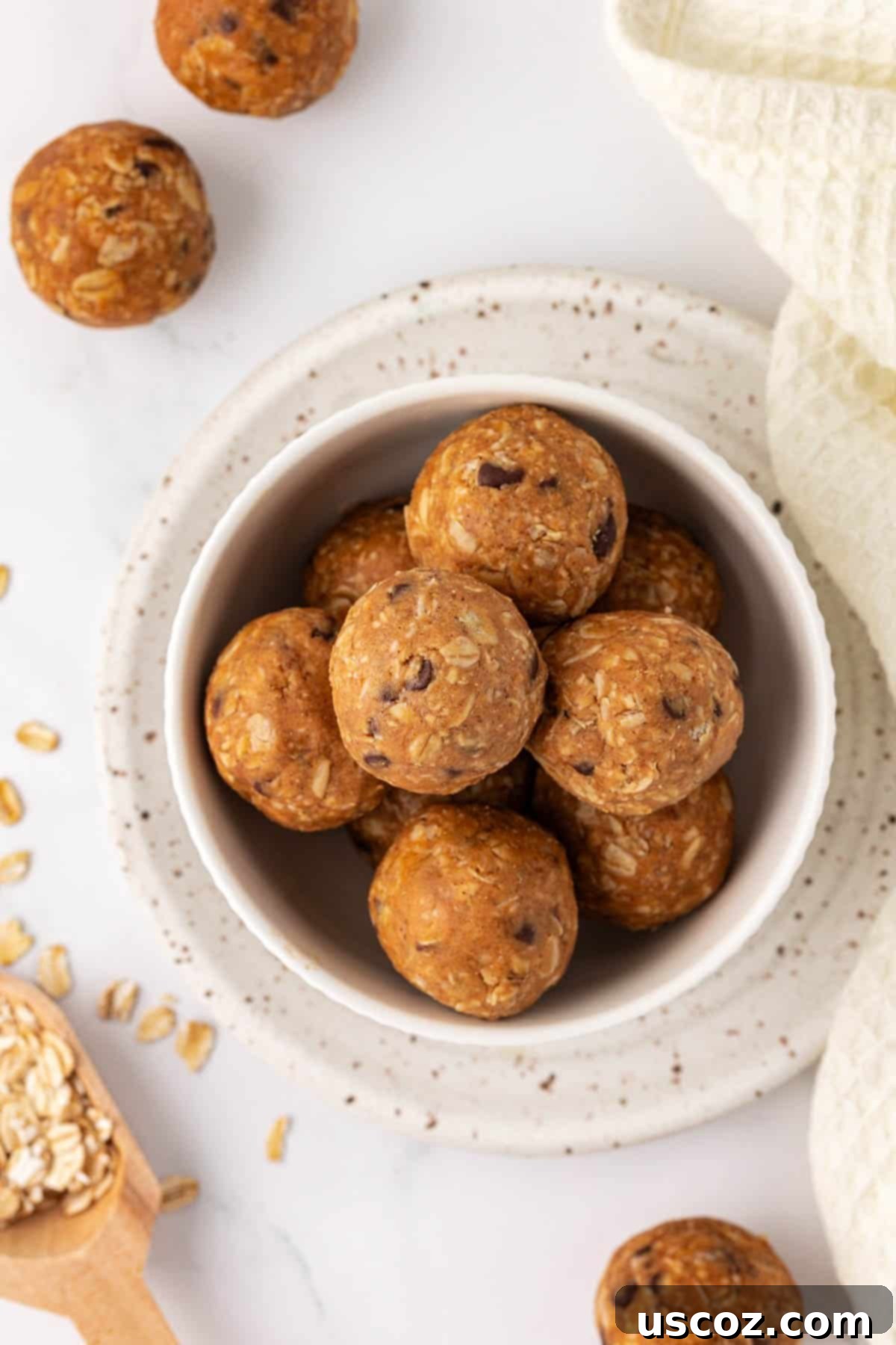 Oat Cookie Power Bites 9 A vibrant display of several oatmeal cookie energy balls arranged beautifully, emphasizing their appealing texture.