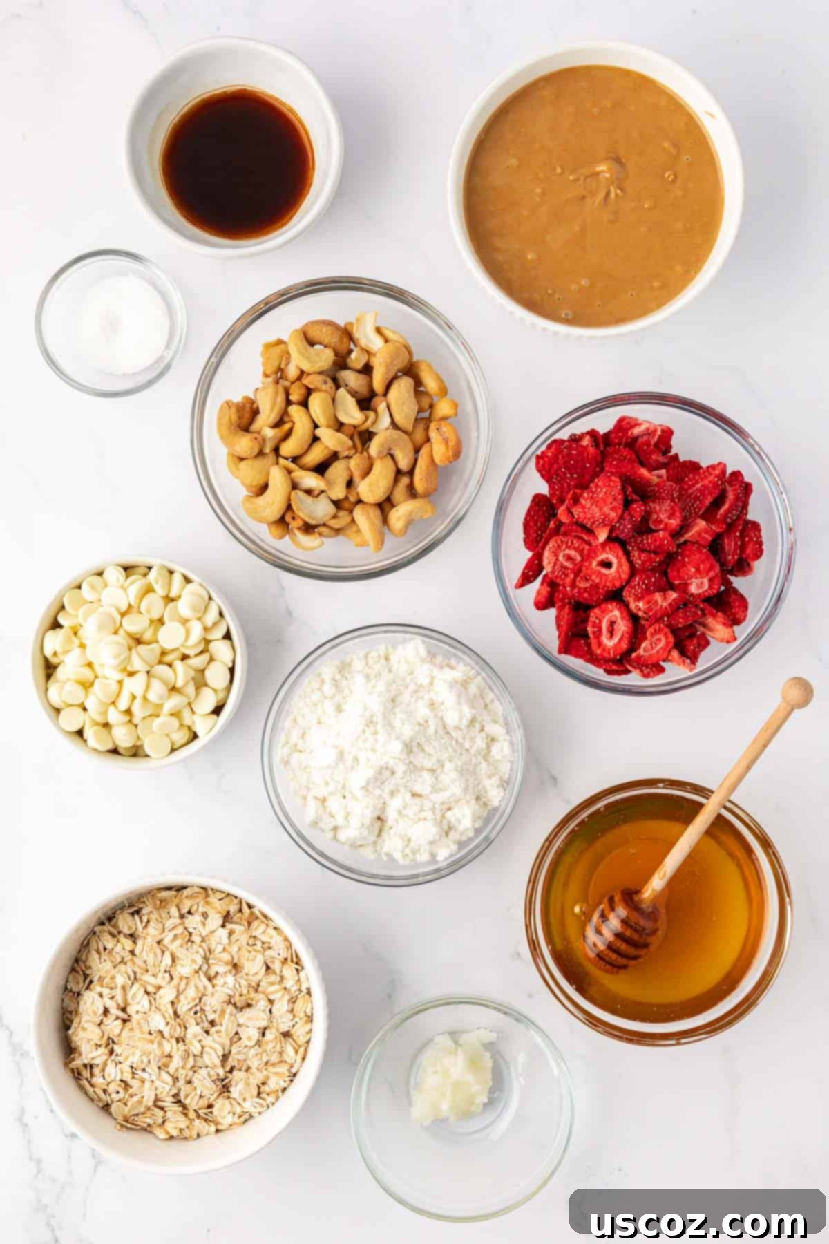 Strawberry Cream Energy Bites 4 ingredients to make strawberries and cream energy bites laid out on a table with a wooden board