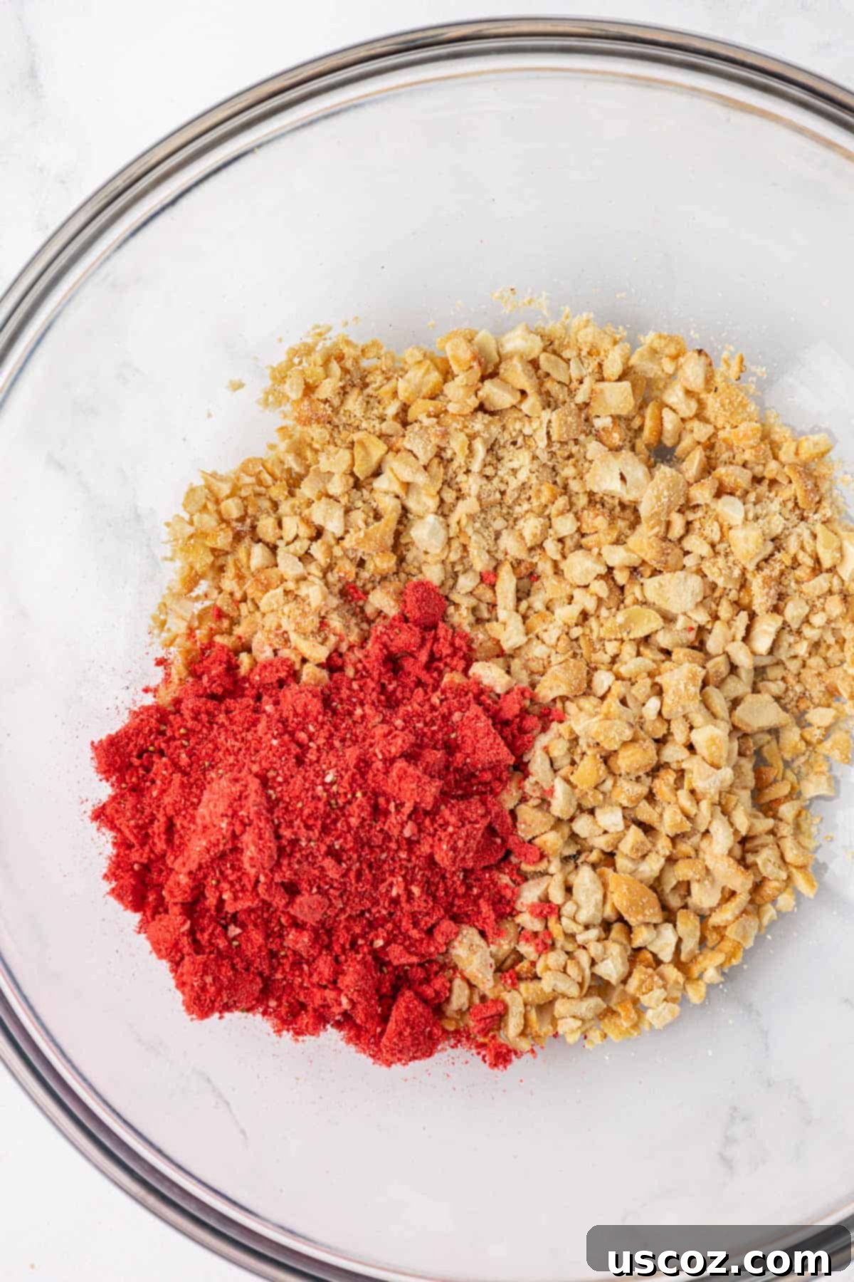 Strawberry Cream Energy Bites 5 pulsed cashews and crushed freeze dried strawberries in separate bowls for energy bites