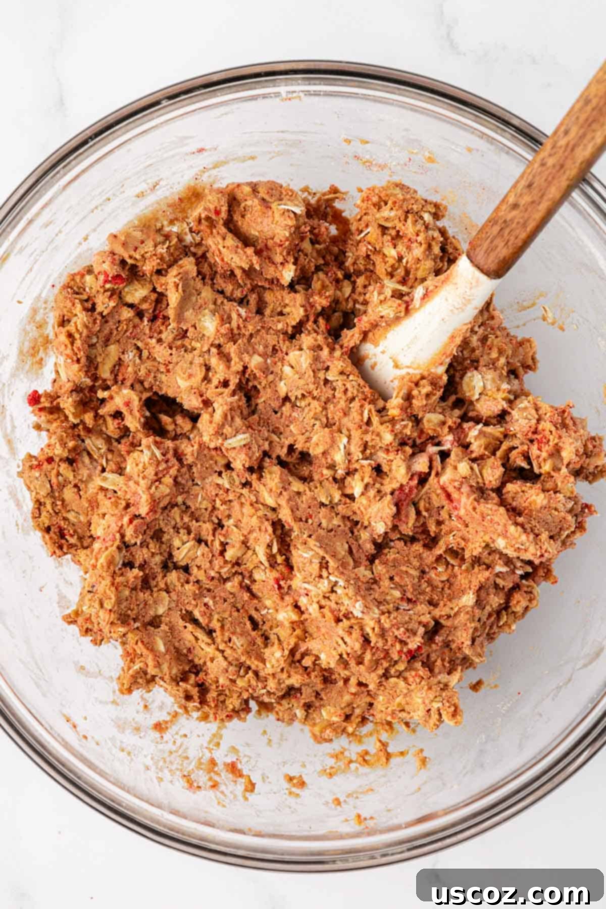 Strawberry Cream Energy Bites 7 energy bite batter fully mixed together in a bowl, showing thick consistency