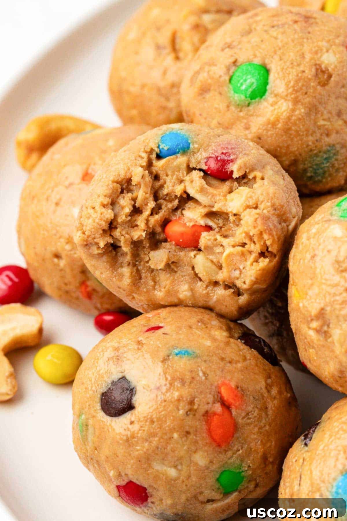 Colorful Chocolate Cashew Crunch Power Bites 8 A stack of finished M&M Cashew Crunch Energy Bites