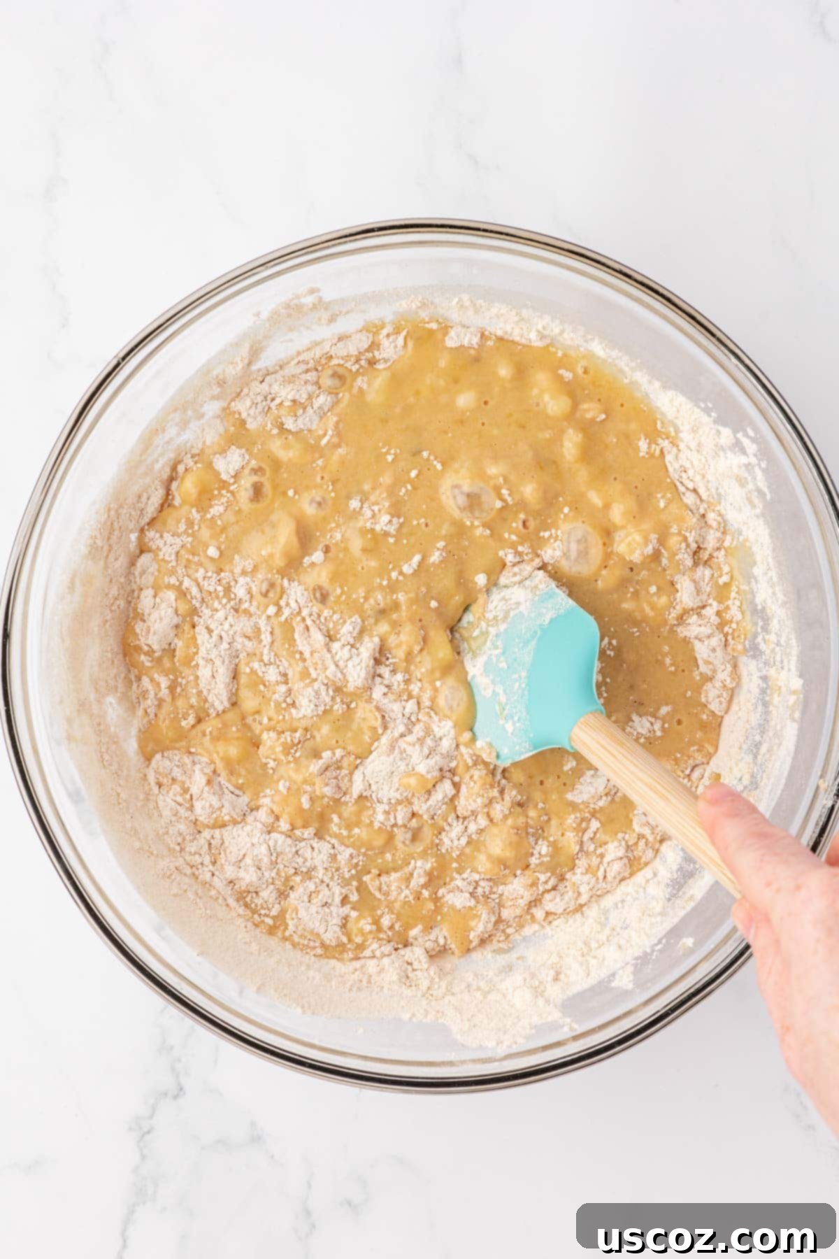Protein-Rich Banana Muffin Bites 13 folding the dry ingredients into the wet ingredients