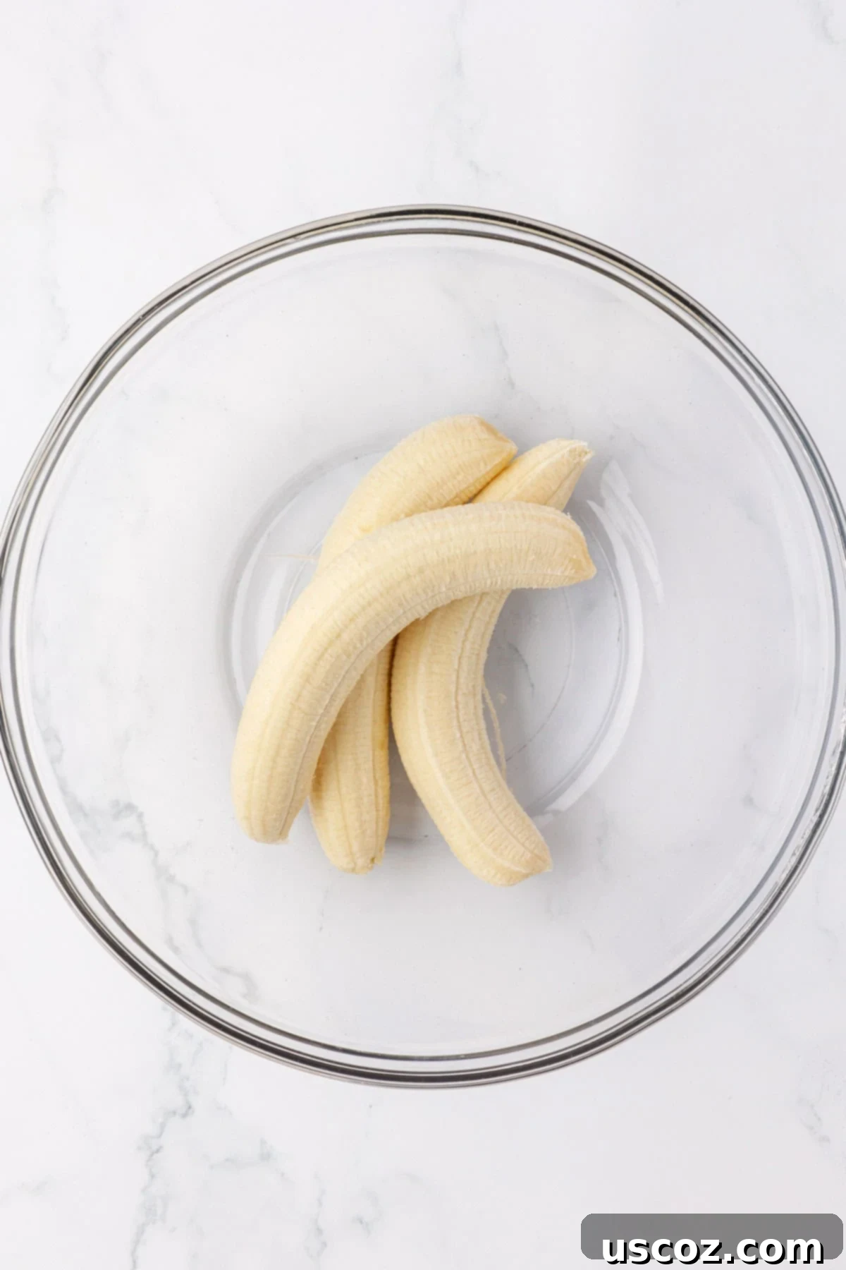 Protein-Rich Banana Muffin Bites 8 bananas in a mixing bowl