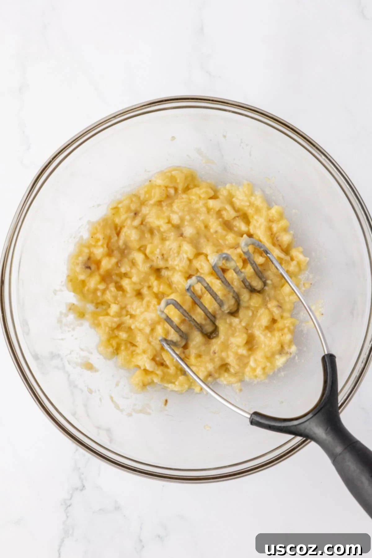 Protein-Rich Banana Muffin Bites 9 mashed bananas in a mixing bowl