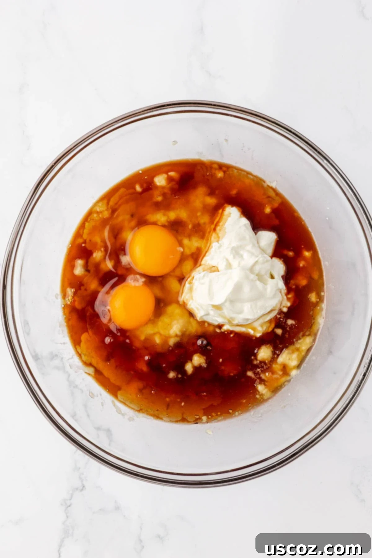 Protein-Rich Banana Muffin Bites 10 wet ingredients in a mixing bowl