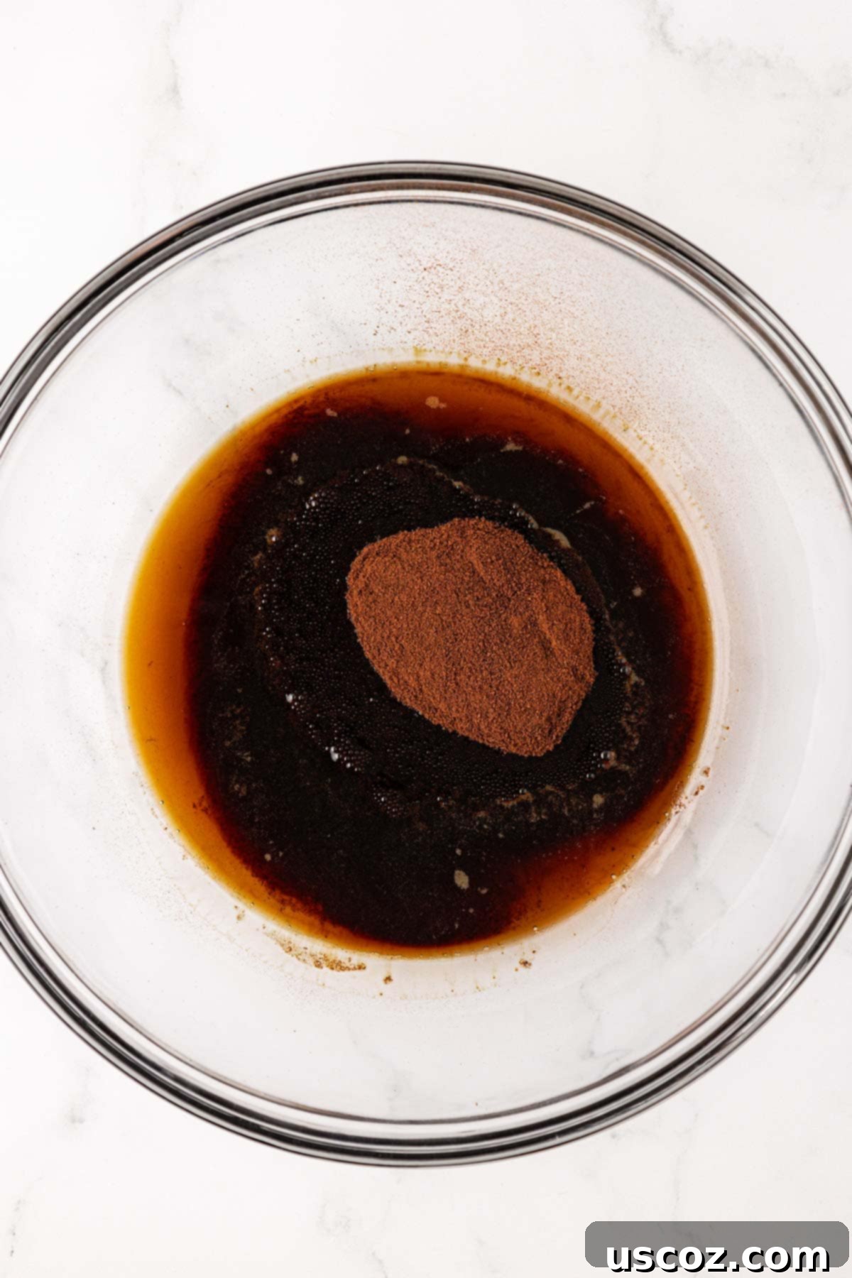 Espresso Boost Bites 5 Maple syrup and instant espresso powder in a mixing bowl before combining