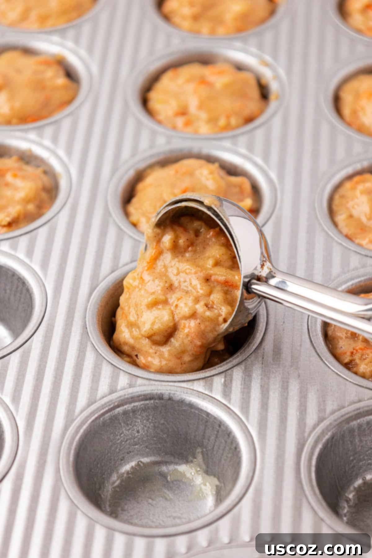Alphabet Mini Muffins 13 mini cookie scoop scooping batter into a mini muffin tin