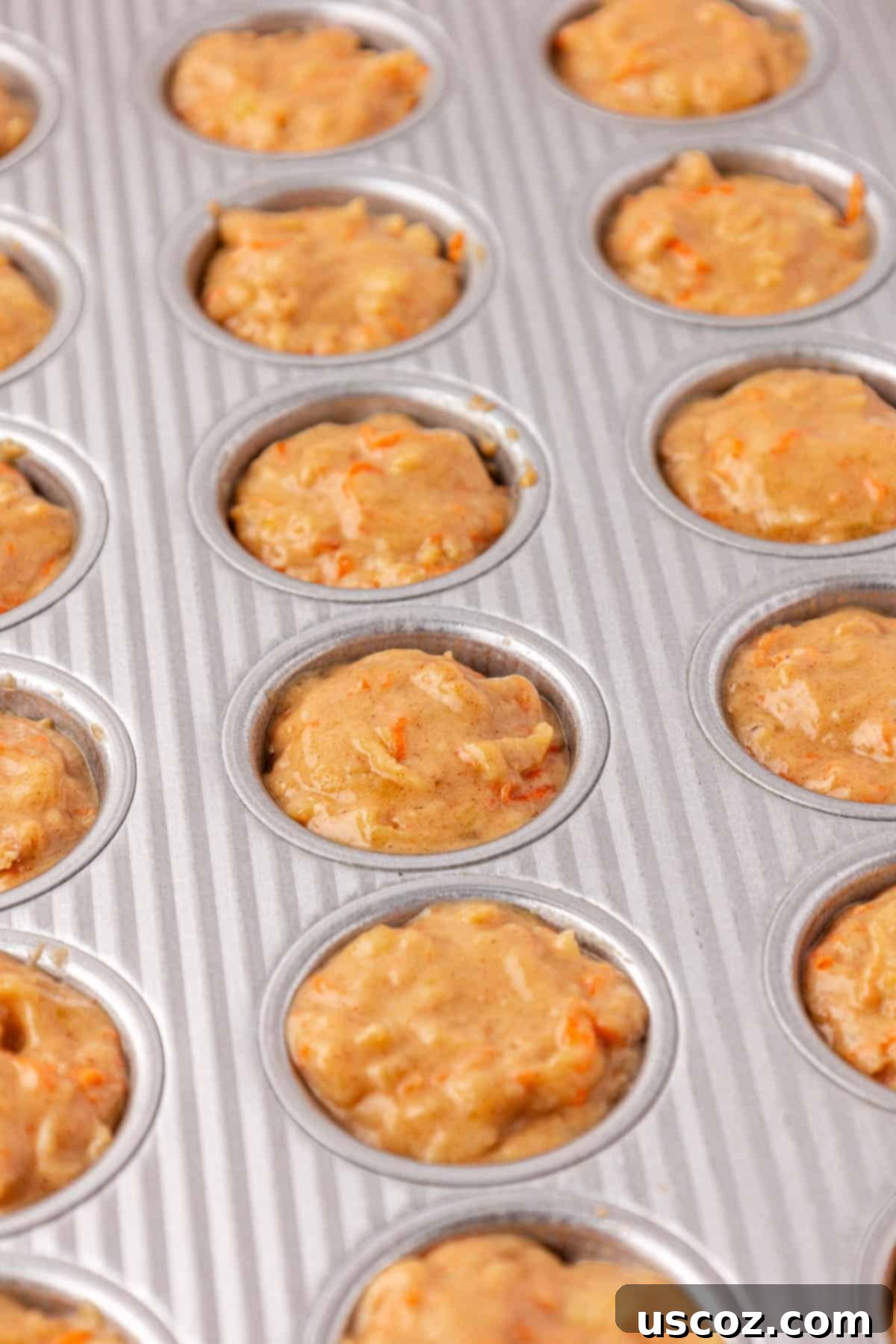 Alphabet Mini Muffins 14 batter evenly distributed in the mini muffin tin