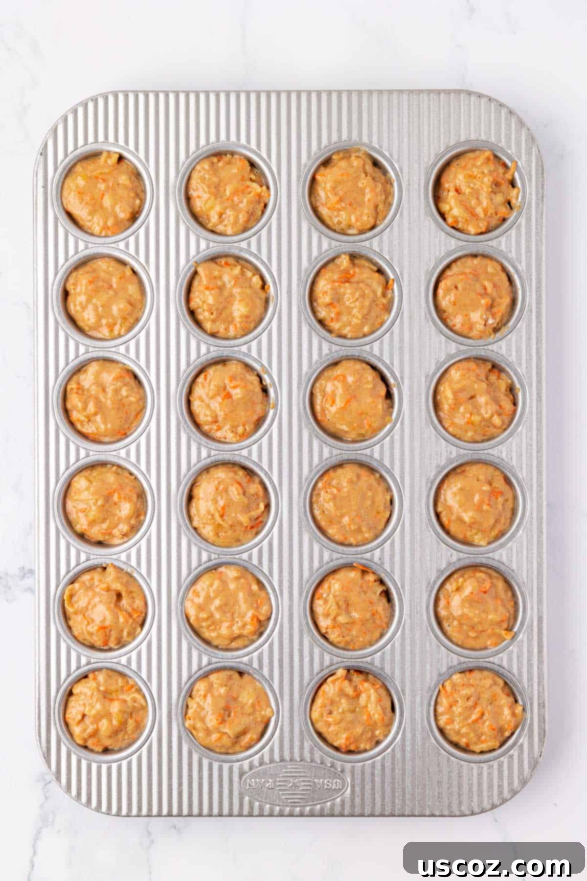 Alphabet Mini Muffins 15 ABC mini muffin batter in a muffin tin, ready for the oven