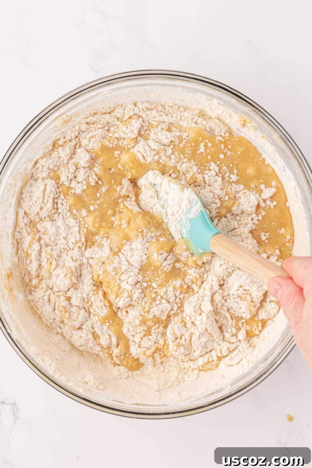 Luscious Greek Yogurt Banana Bread 11 stirring the dry ingredients into the wet ingredients