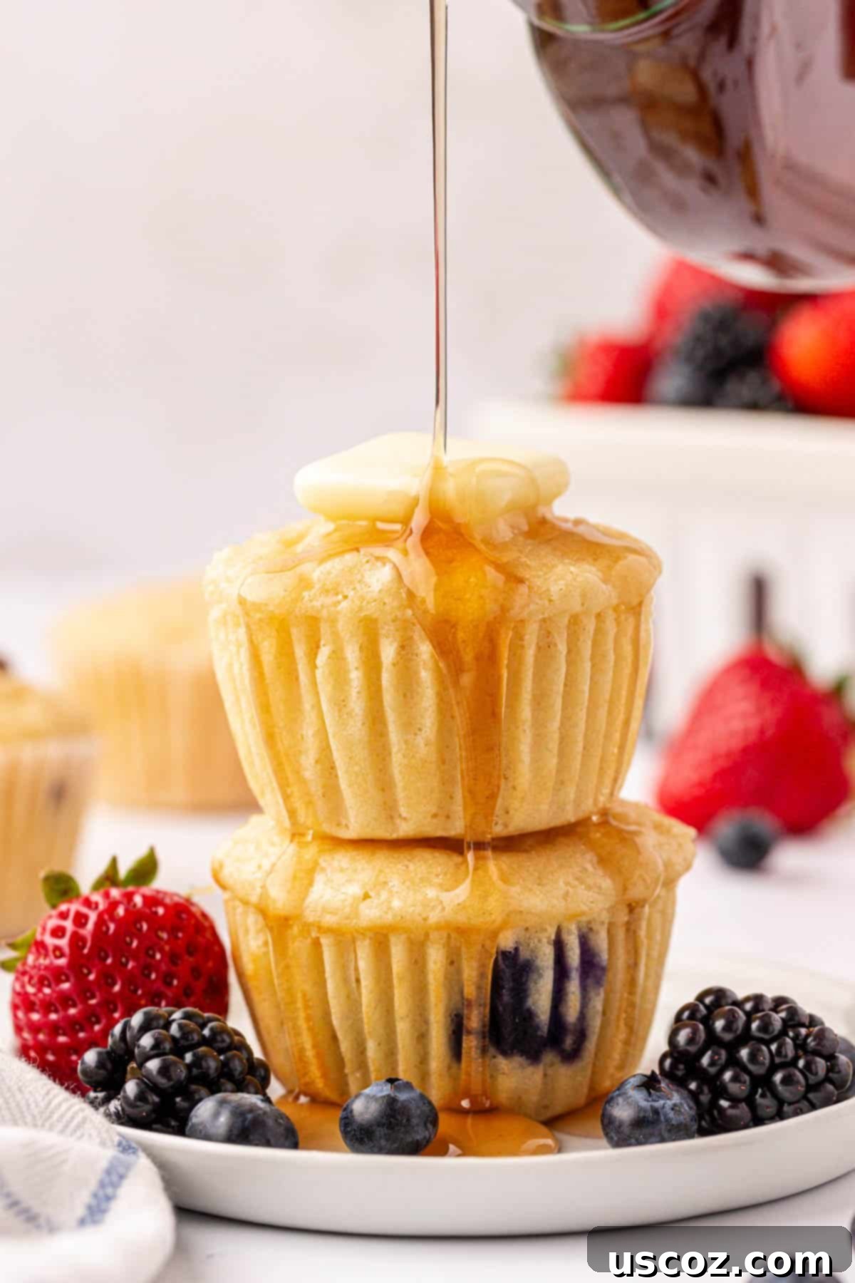 Fluffy Pancake Puffs 2 pancake muffins topped with butter and syrup