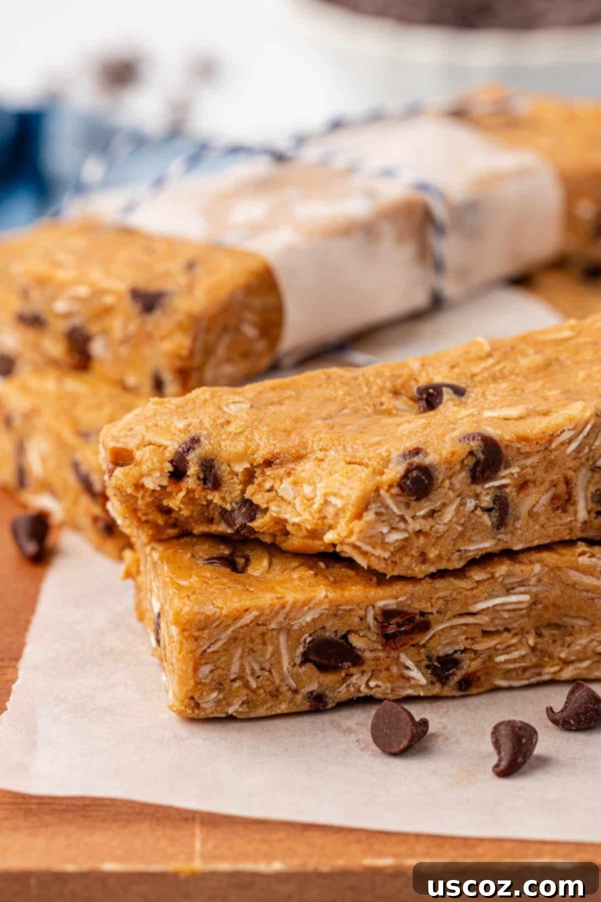 Power-Packed Protein Granola Bars 11 A single homemade protein granola bar on a wooden surface, highlighting its texture
