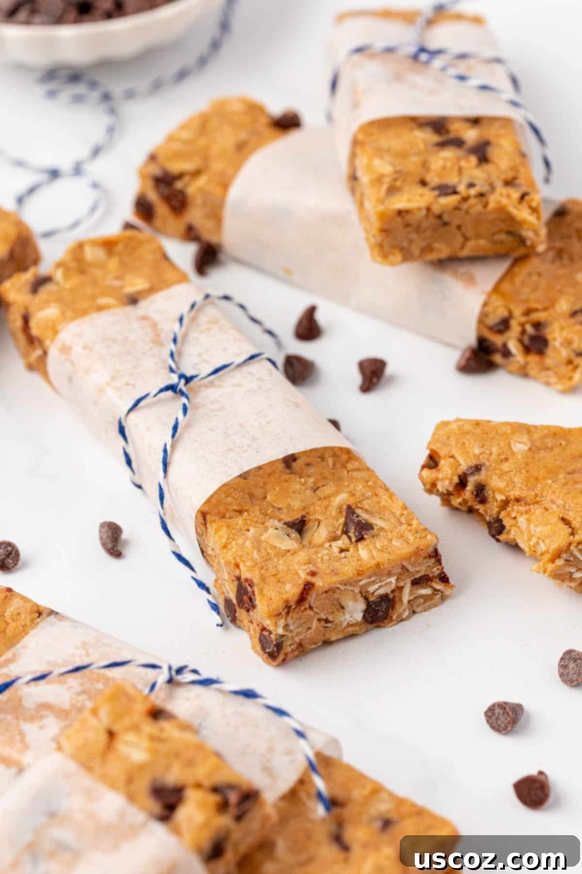 Power-Packed Protein Granola Bars 13 Several homemade protein granola bars stacked, with one bitten to show the inside texture