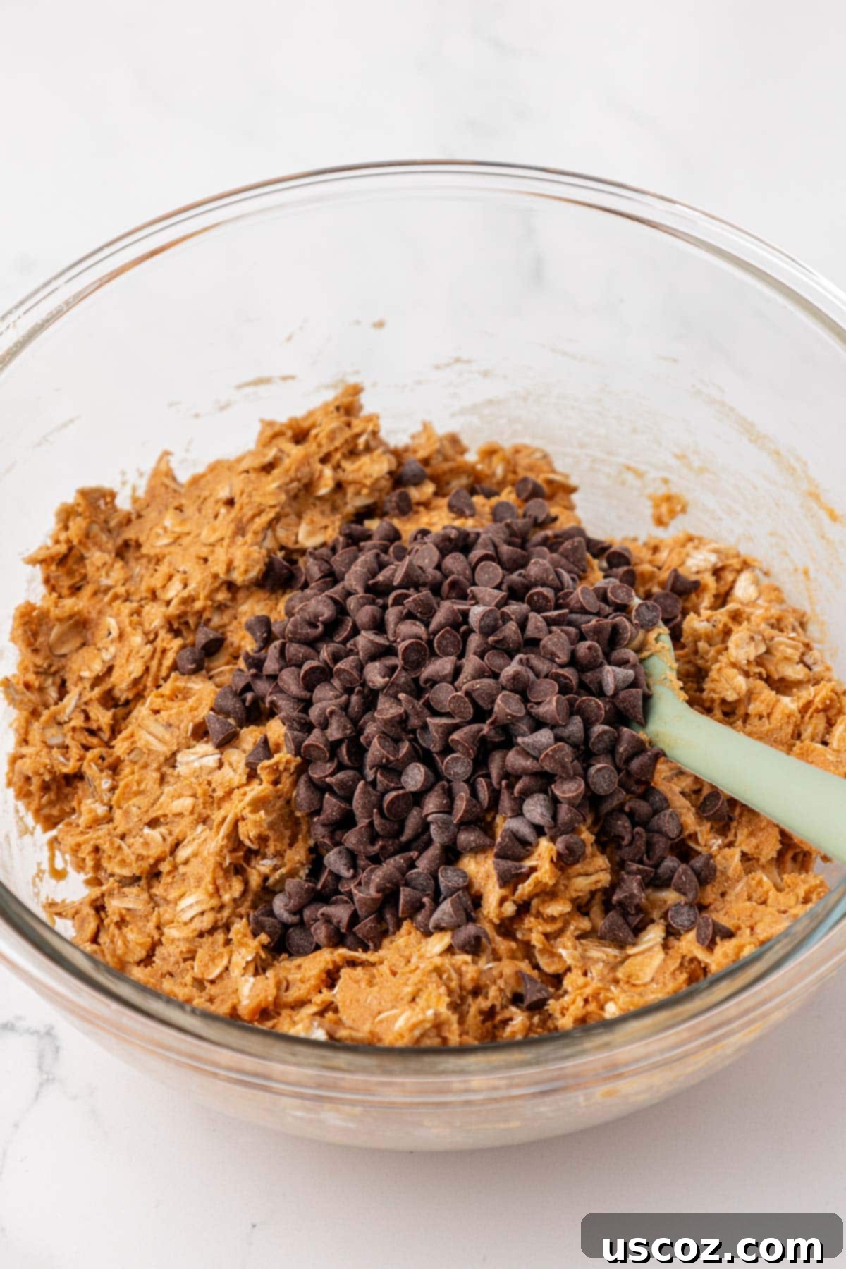 Power-Packed Protein Granola Bars 7 Adding mini chocolate chips to the cooled protein granola bar batter