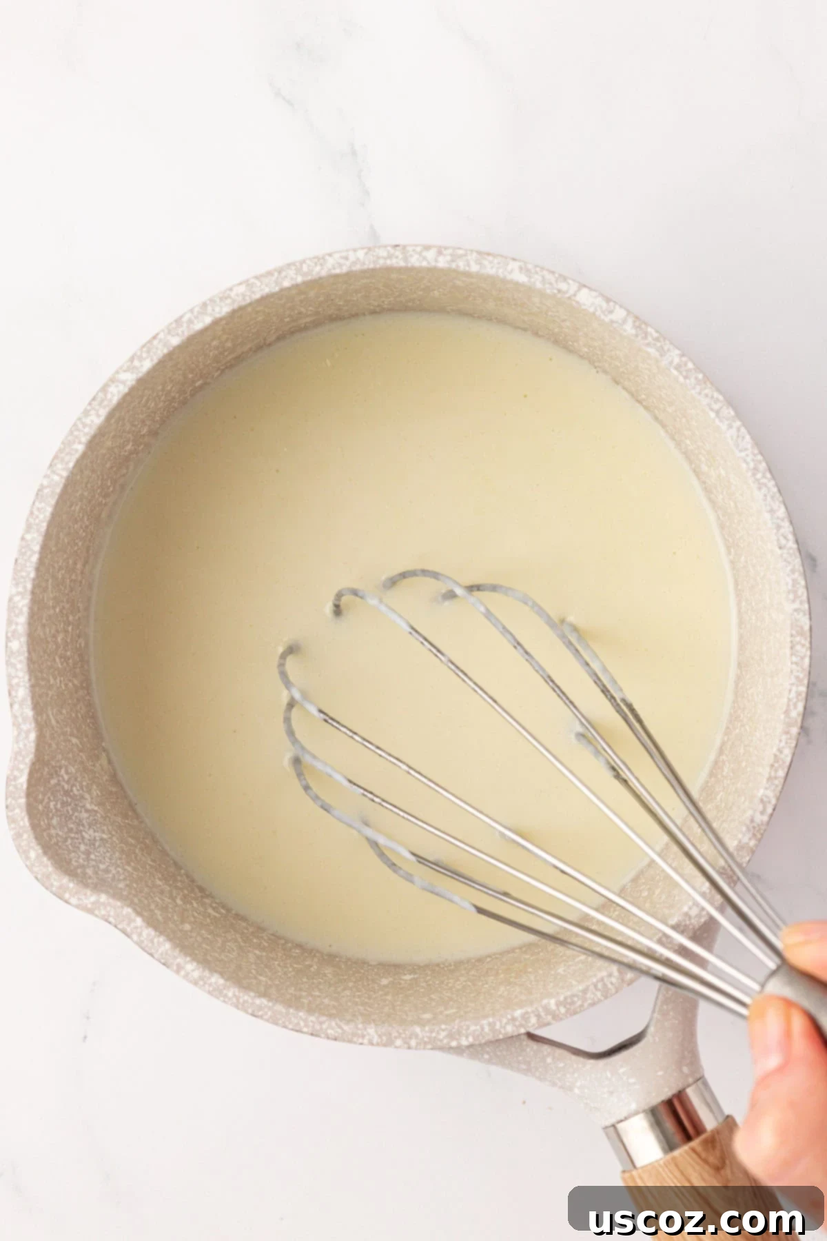 Creamy Broccoli Mac and Cheese 13 whisking the milk in