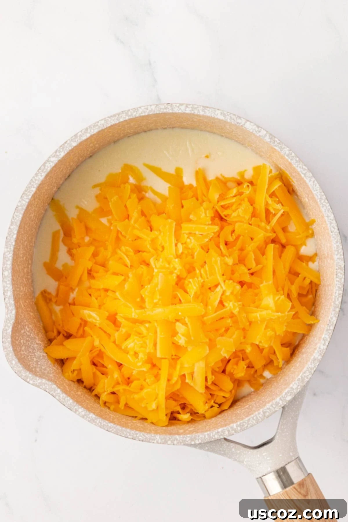 adding the cheese to the roux