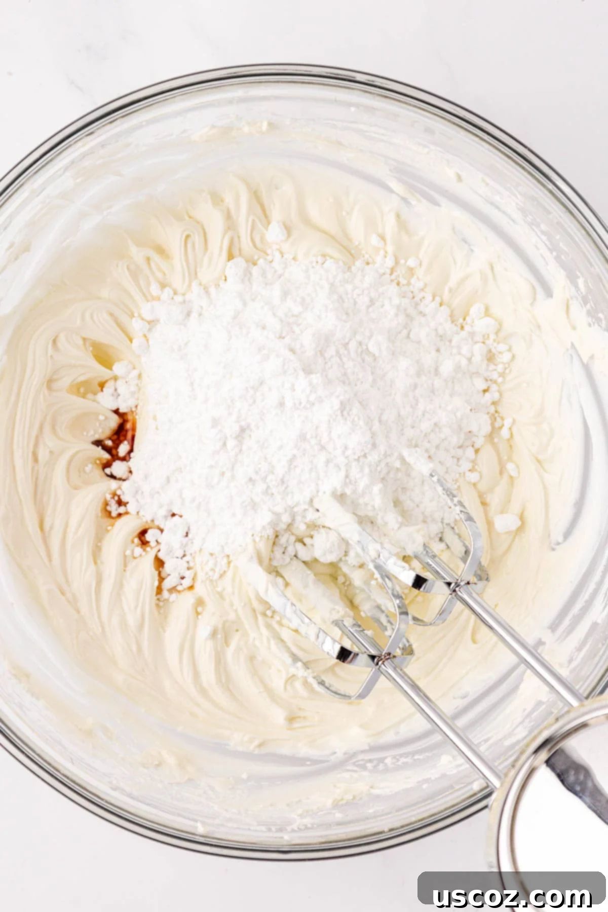 Wholesome Carrot Cake Bars 15 adding powdered sugar and vanilla extract to the cream cheese frosting