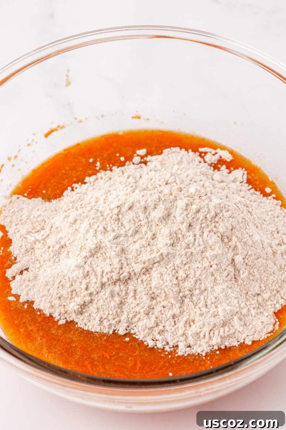 Wholesome Carrot Cake Bars 9 adding the dry ingredients to the wet ingredients