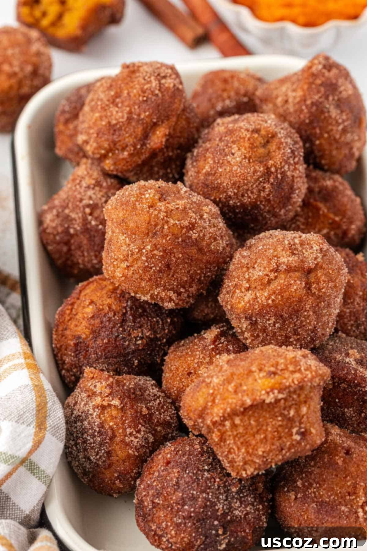 stack of pumpkin donut mini muffins